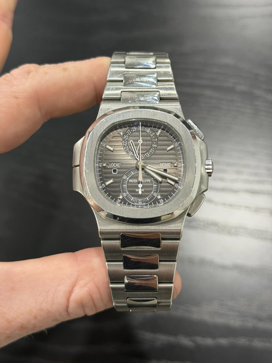 May be an image of wrist watch and text