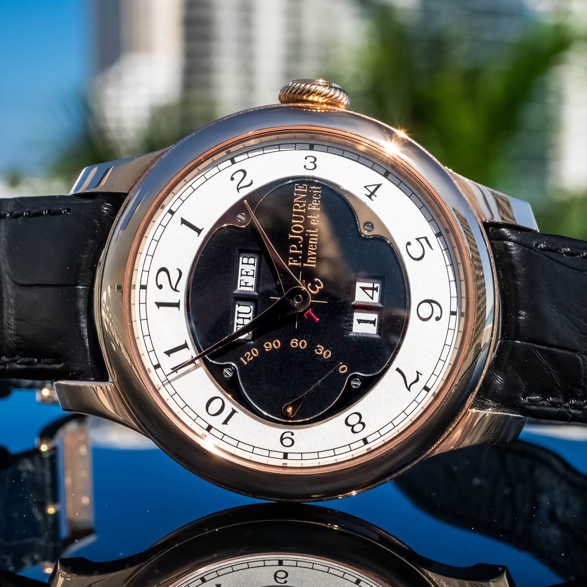 May be an image of wrist watch and text that says '2 شر PJOURNE Invenite eL Fecit 1 12 一· ك 5 1 ق 福 ف S 10 9/ ح و 8'