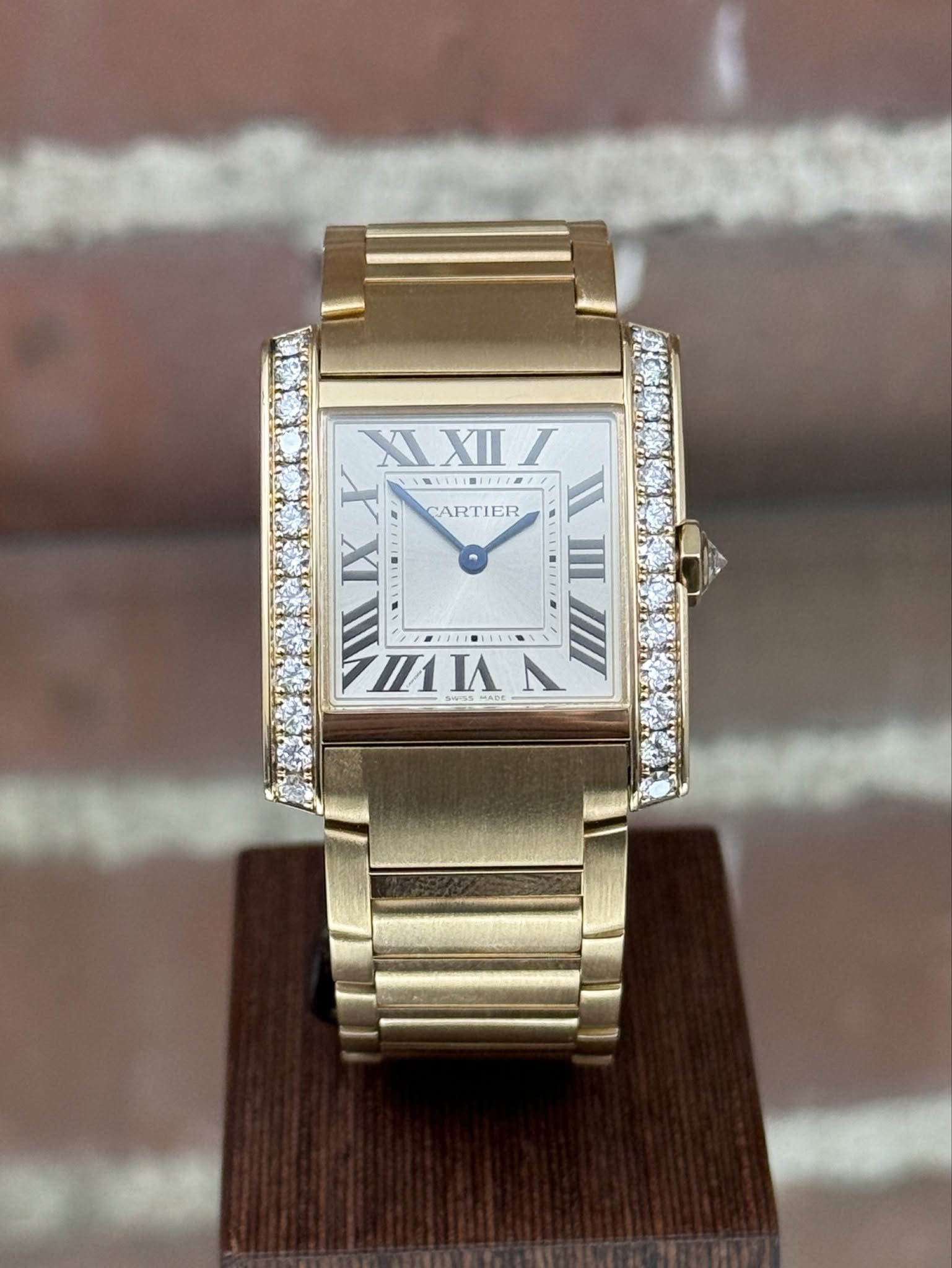 May be an image of wrist watch and text