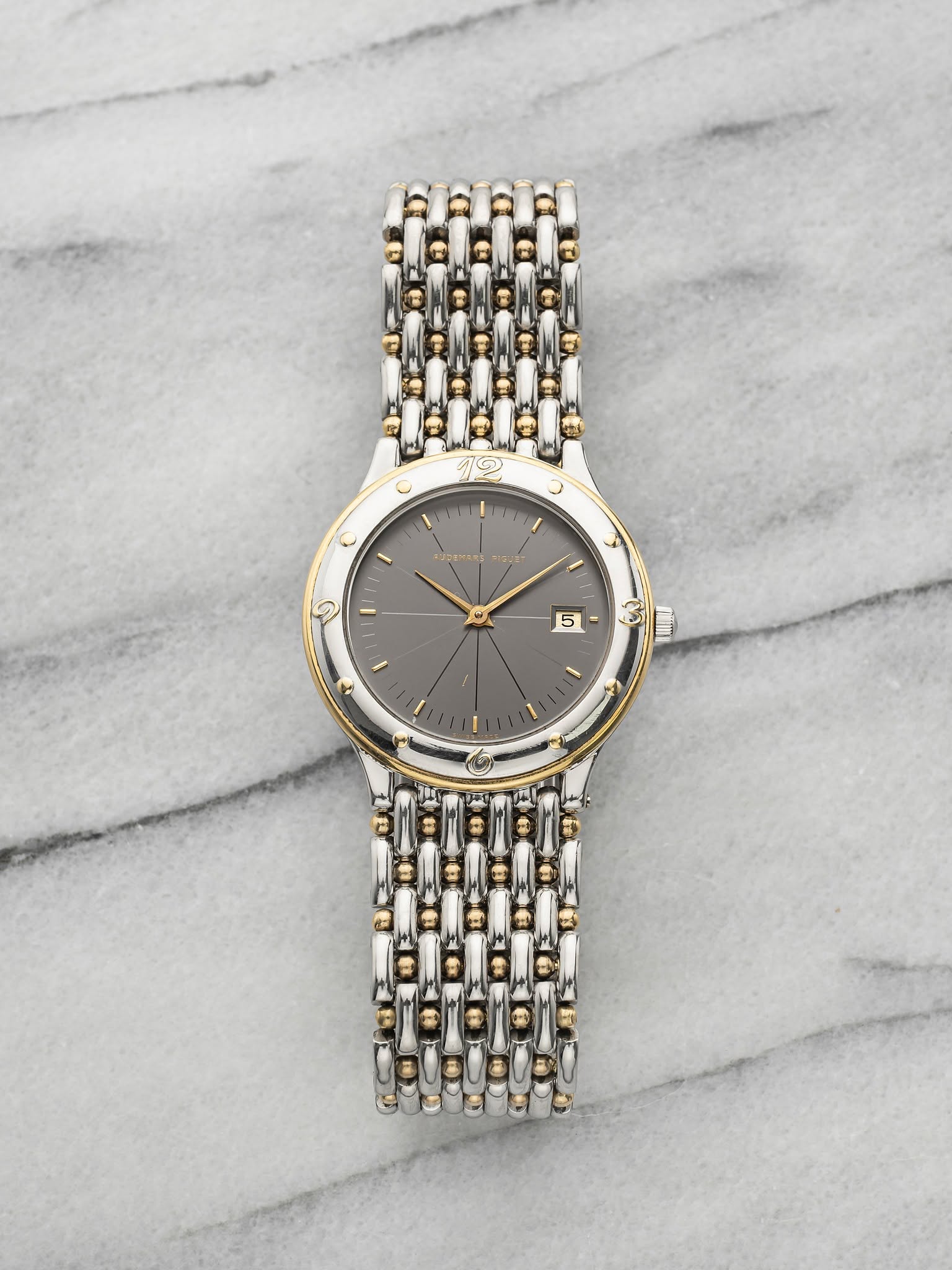 May be an image of wrist watch and text