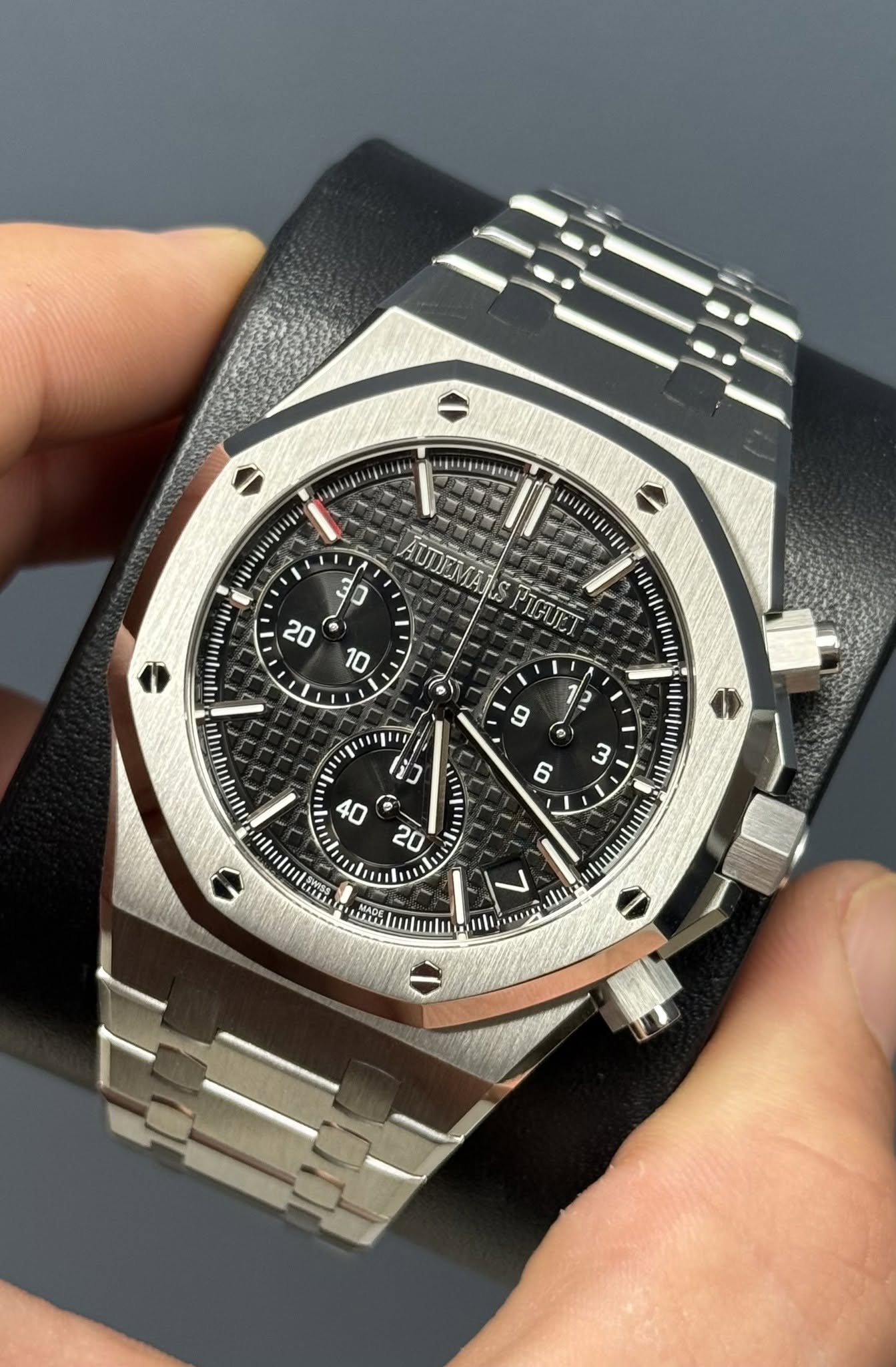 May be an image of wrist watch and text
