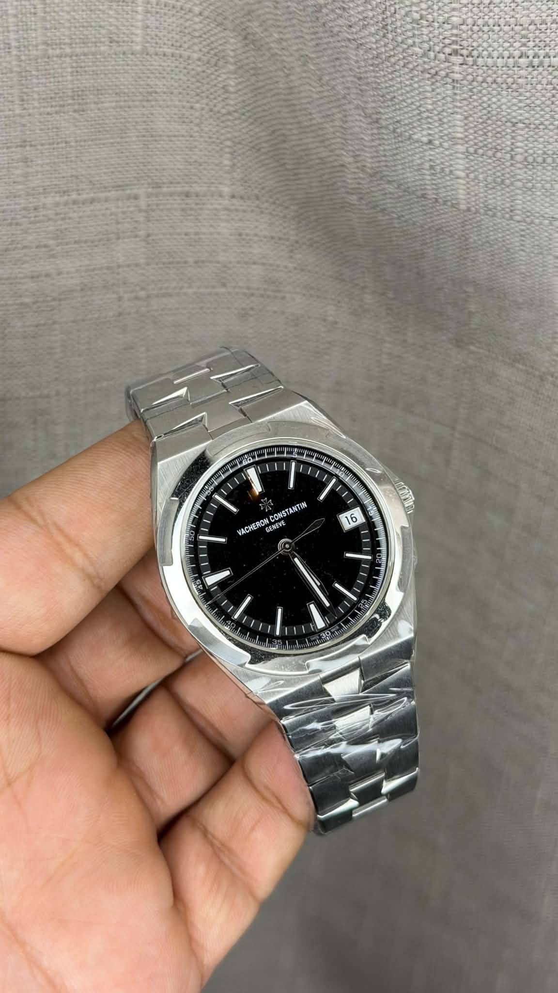 May be an image of wrist watch and text