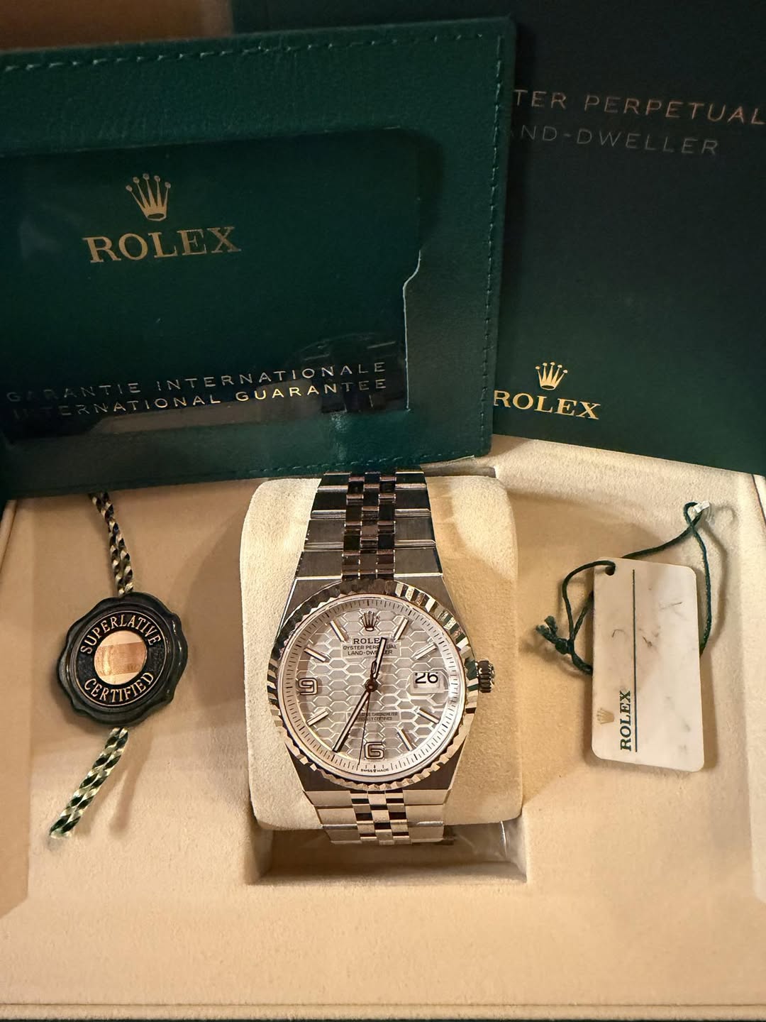 May be an image of wrist watch and text