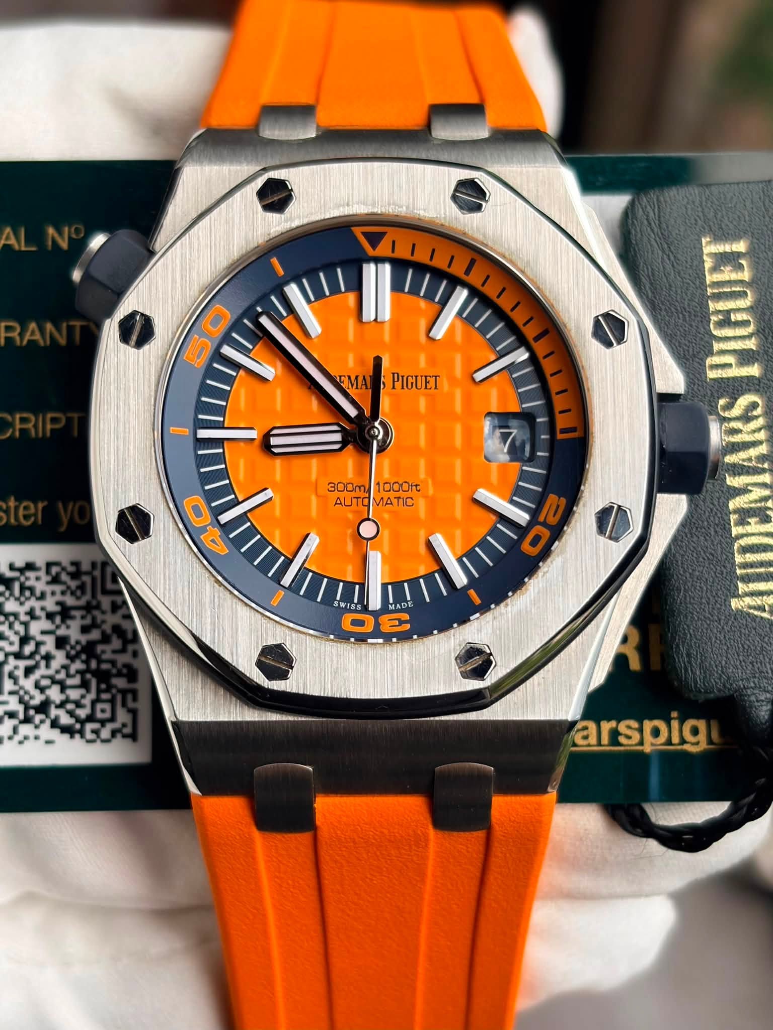 May be an image of wrist watch and text that says '50 EMARS EMAPIGUET EMAT PIGUET IDE 300M 1000ft AUTO 300m1000rt AUTOMATIC AUTOMATIC MATIC 0 40 O WIS I5s MADE DE arspig'