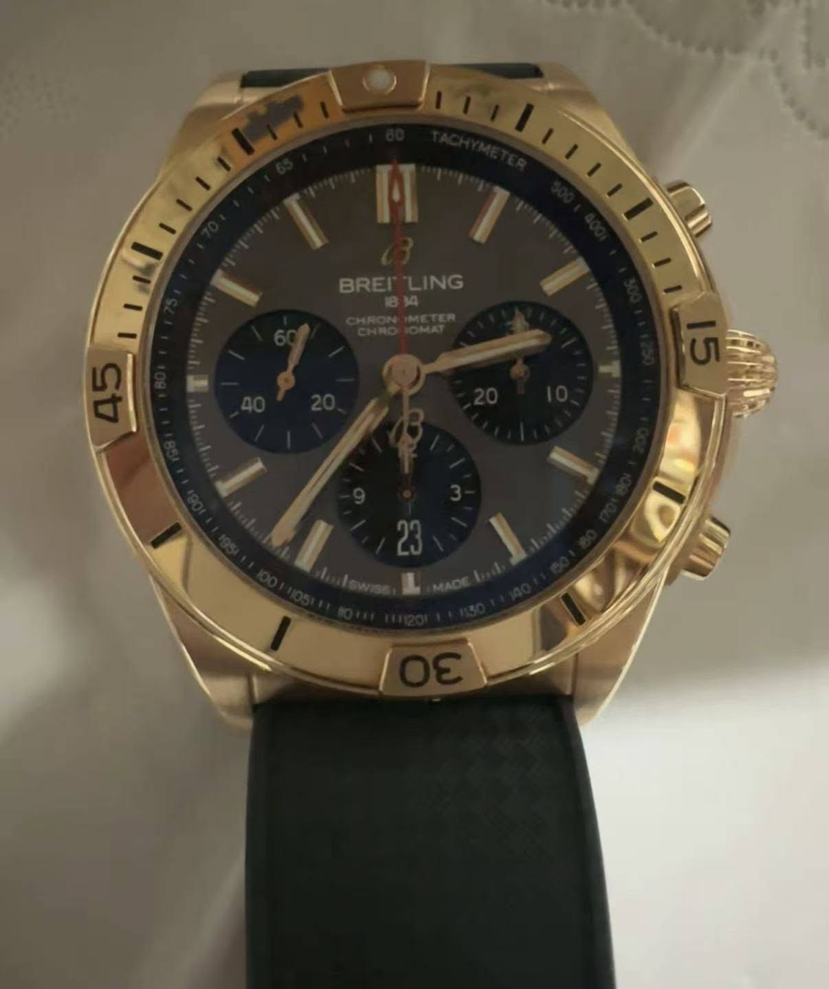 May be an image of wrist watch and text
