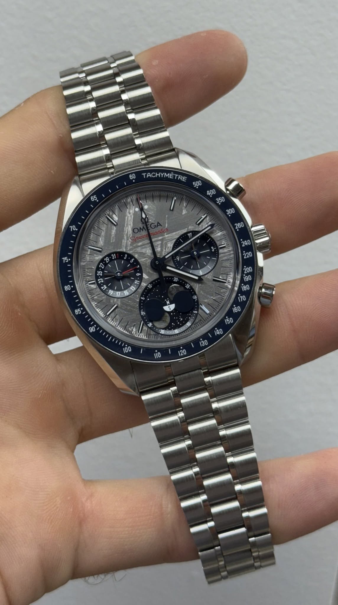 May be an image of wrist watch and text
