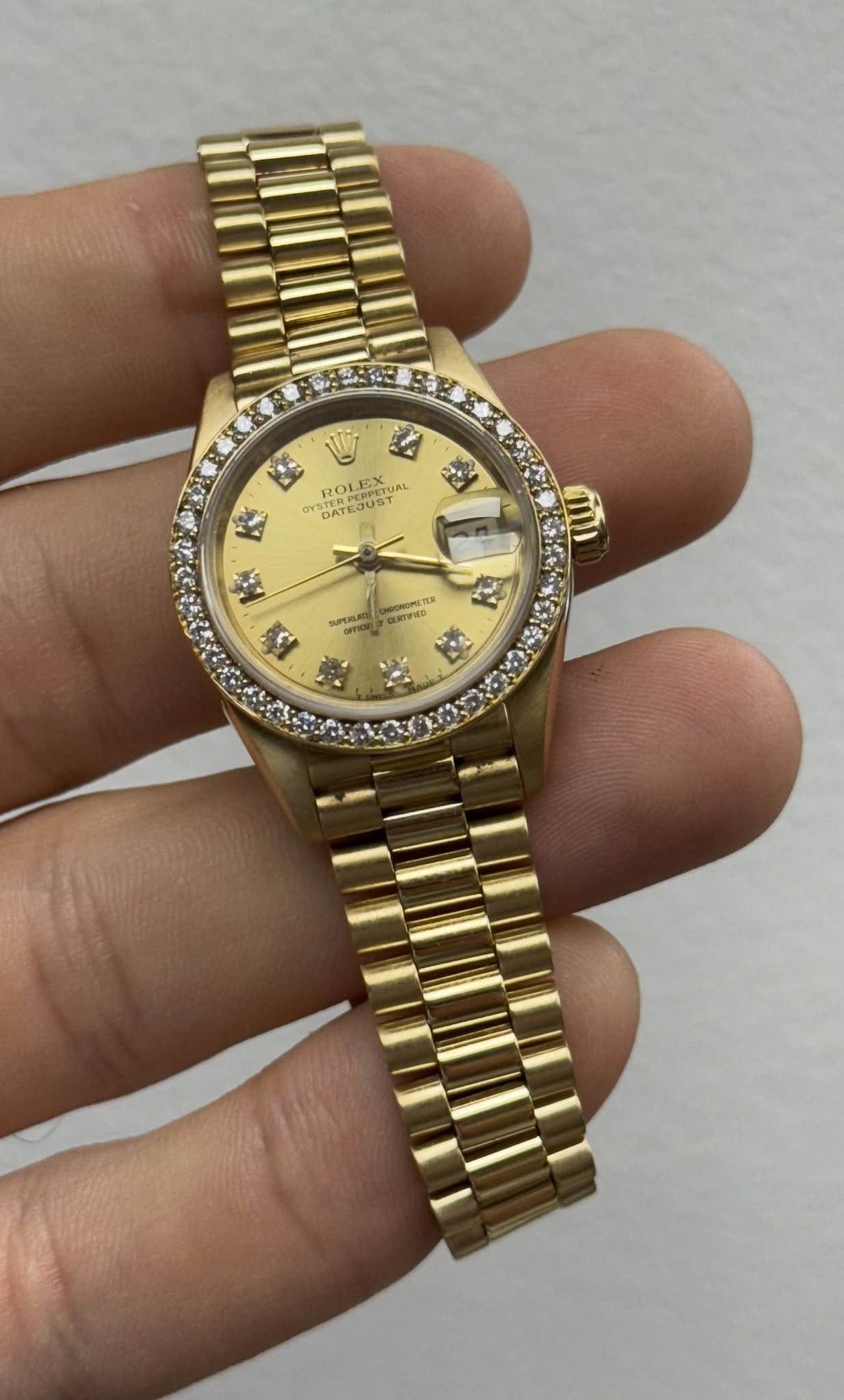 May be an image of wrist watch and text
