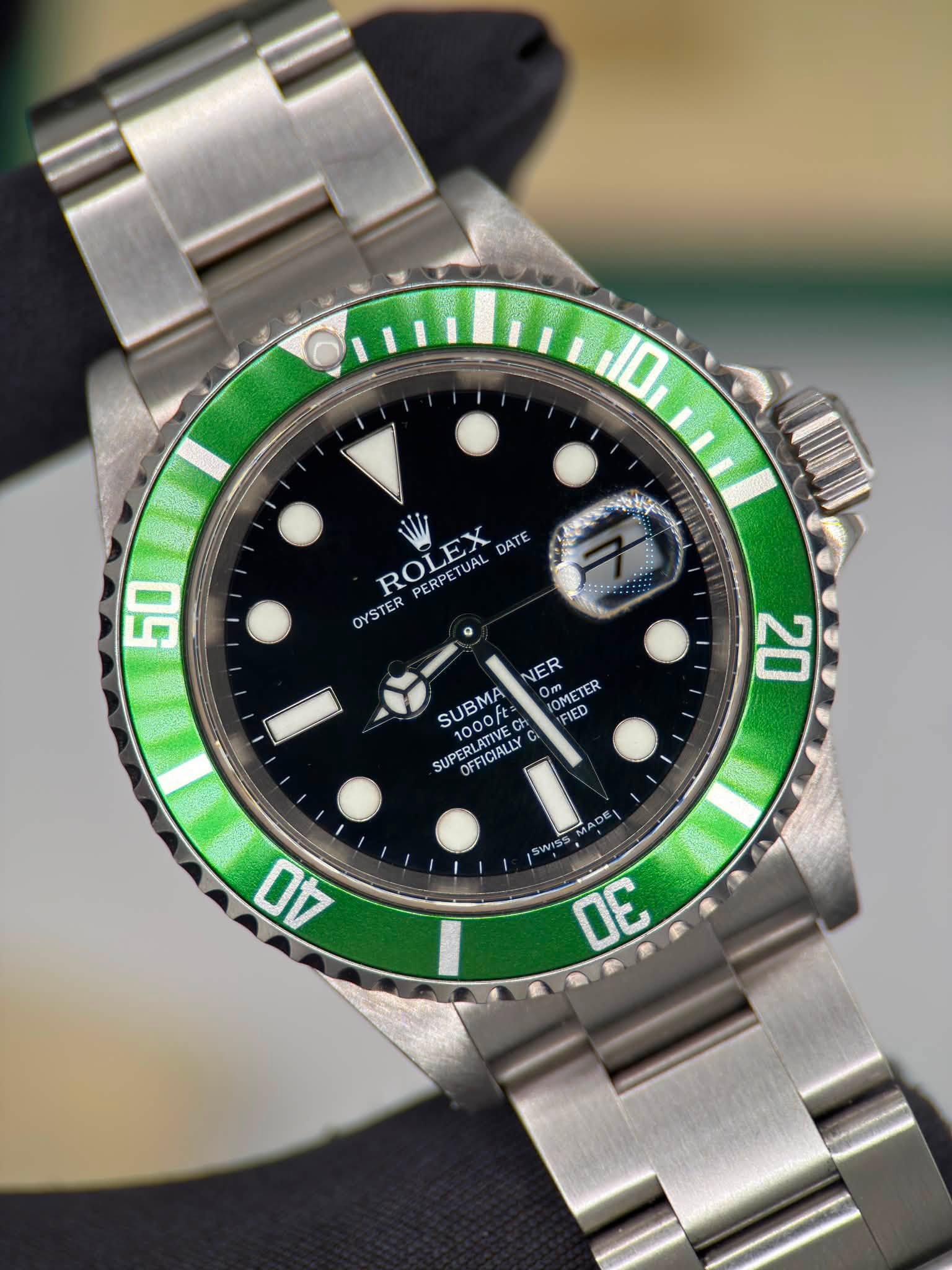 May be an image of wrist watch and text that says 'ROLEX DATE PERPETUAL OYSTER TER 50 NER SUBMA SUPERLATIVE 1000 ERLAIYEC MMCTP IOMETER FIED 1000f SUP SUPERLATIV OFFICIALLY CA C 20…