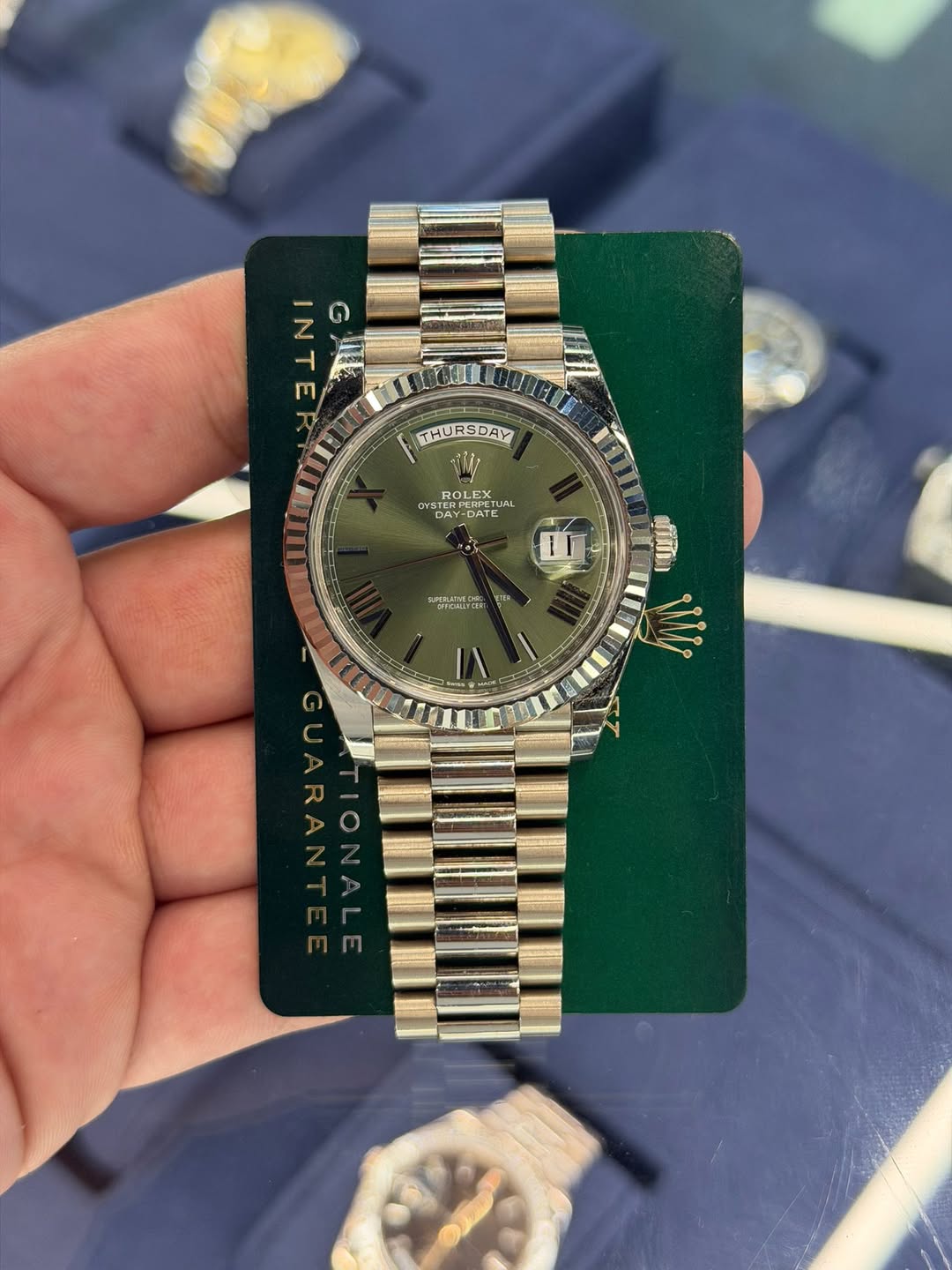 May be an image of wrist watch and text