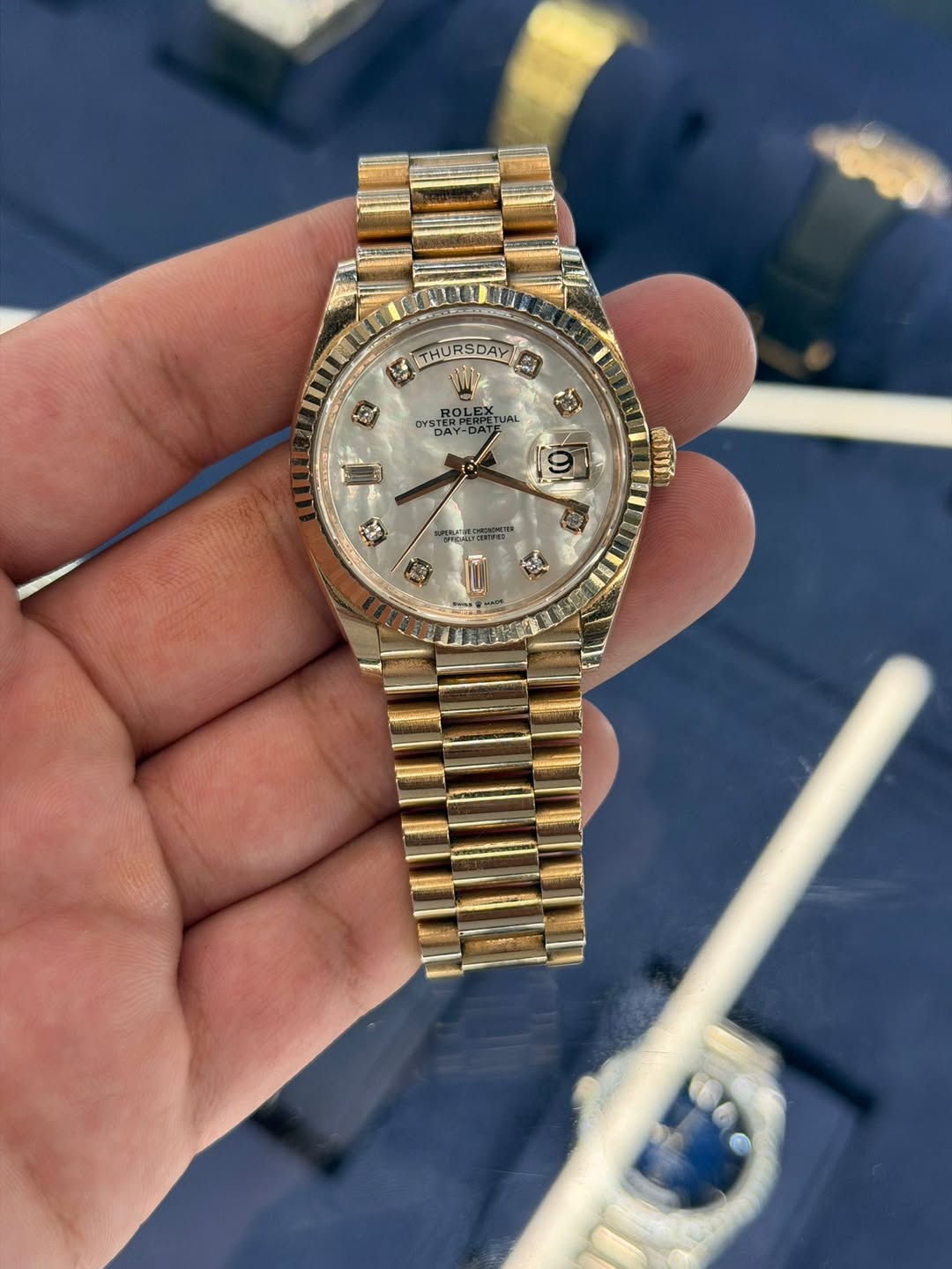 May be an image of wrist watch and text
