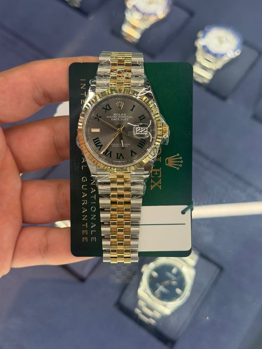 May be an image of wrist watch and text