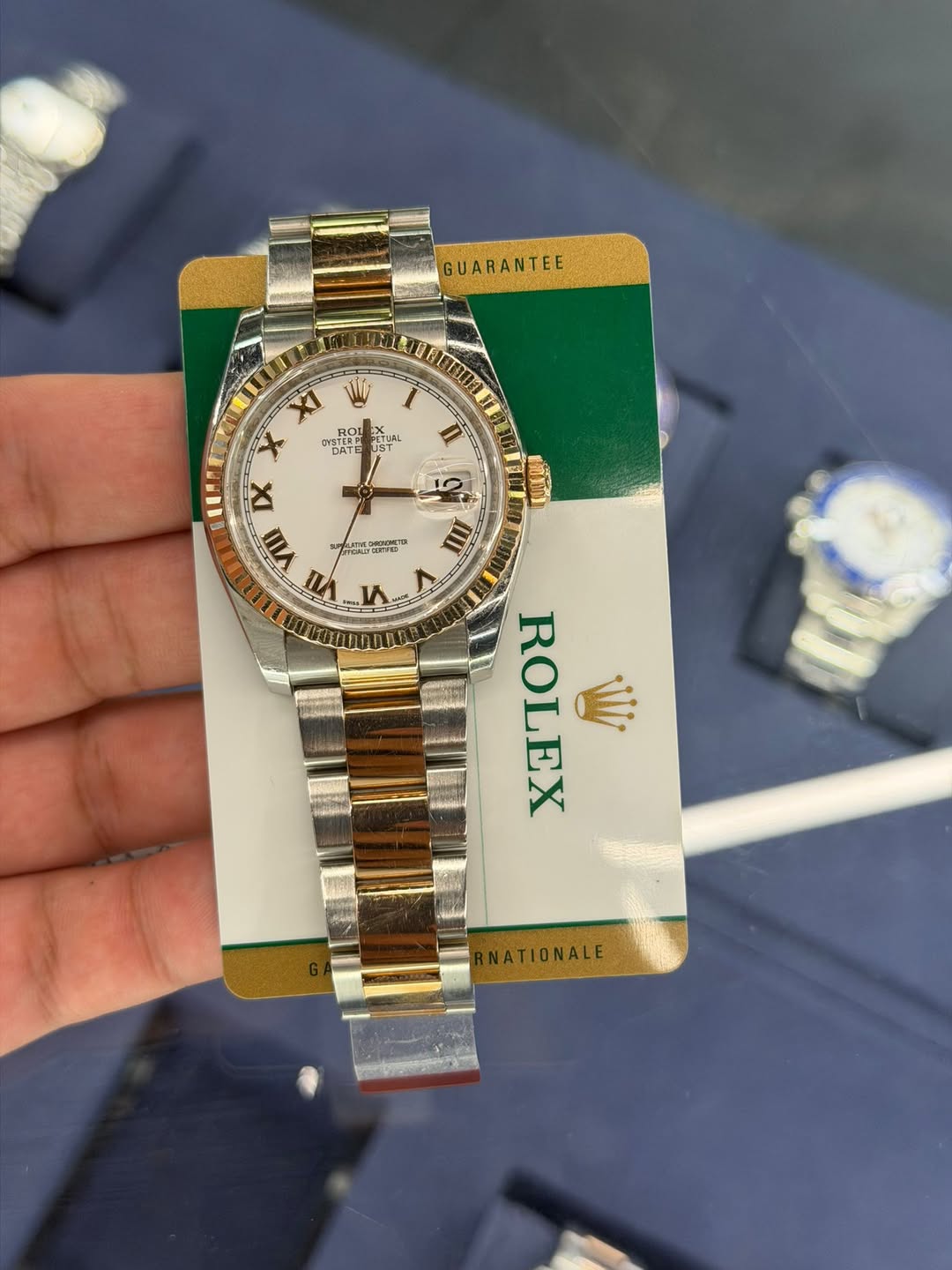 May be an image of wrist watch and text
