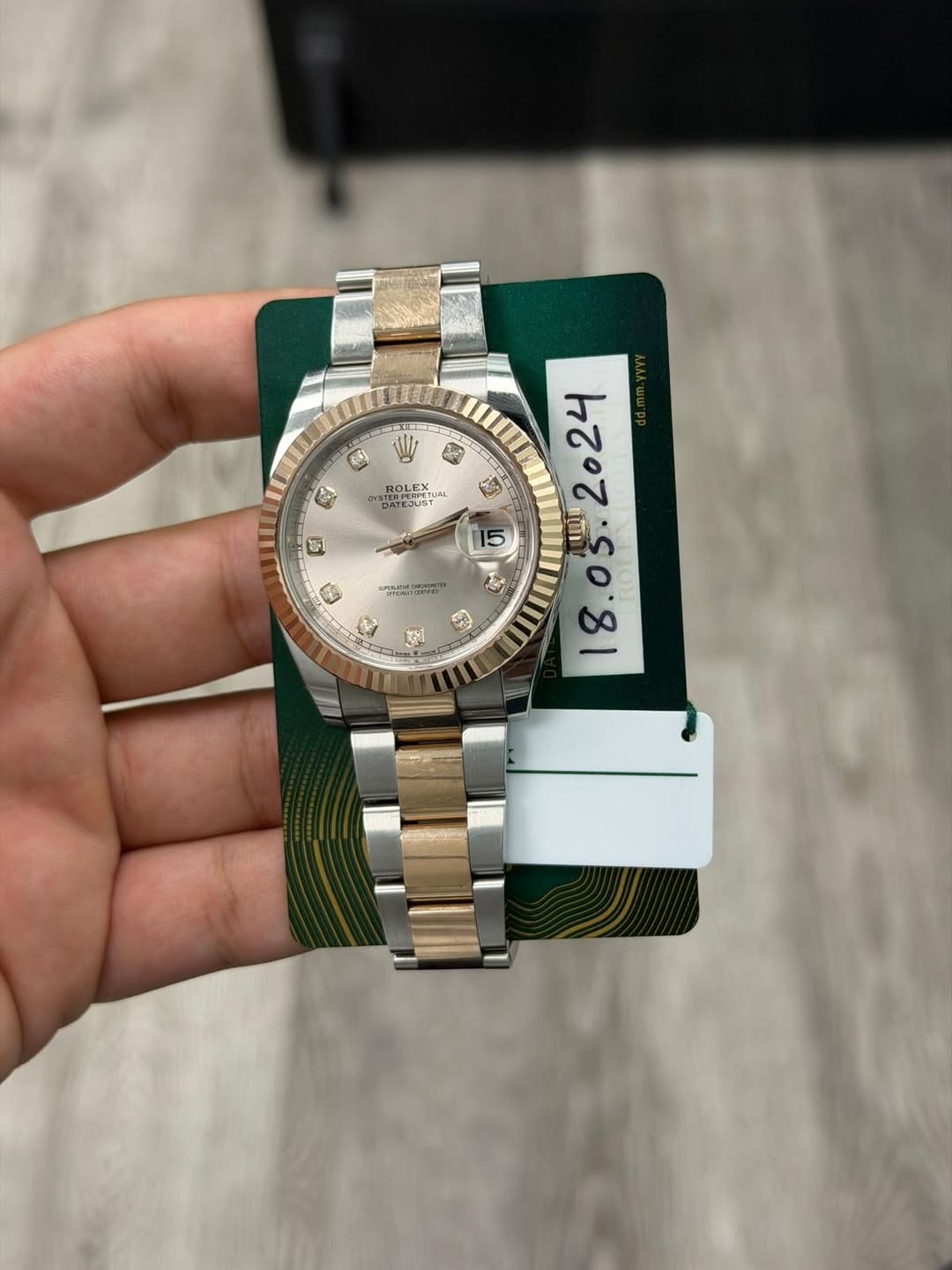 May be an image of wrist watch and text