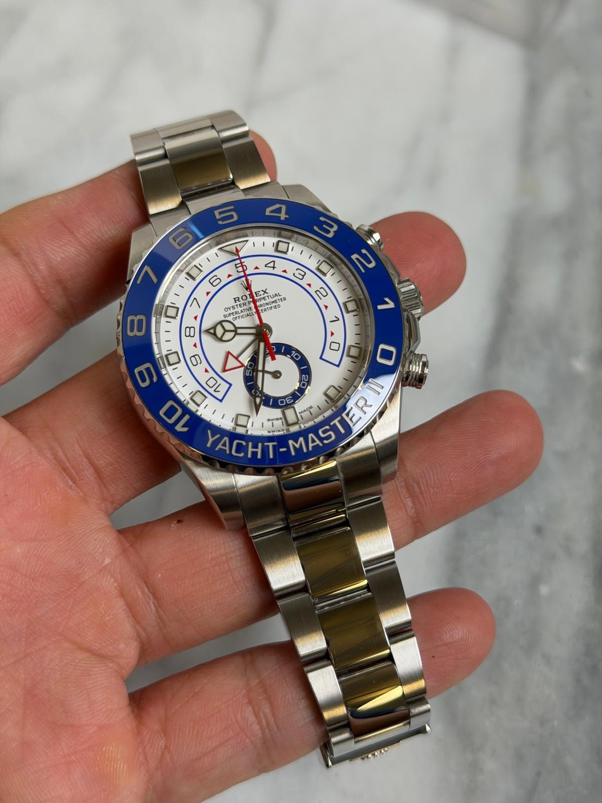 May be an image of wrist watch and text