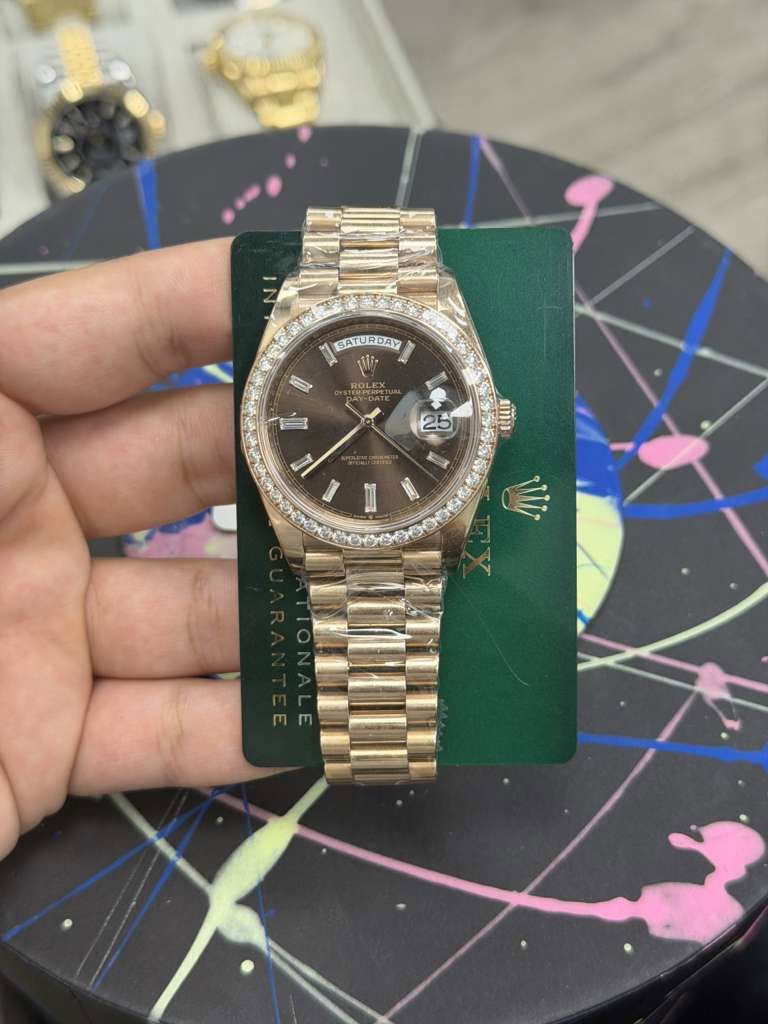 May be an image of wrist watch and text