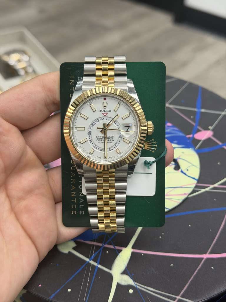 May be an image of wrist watch and text
