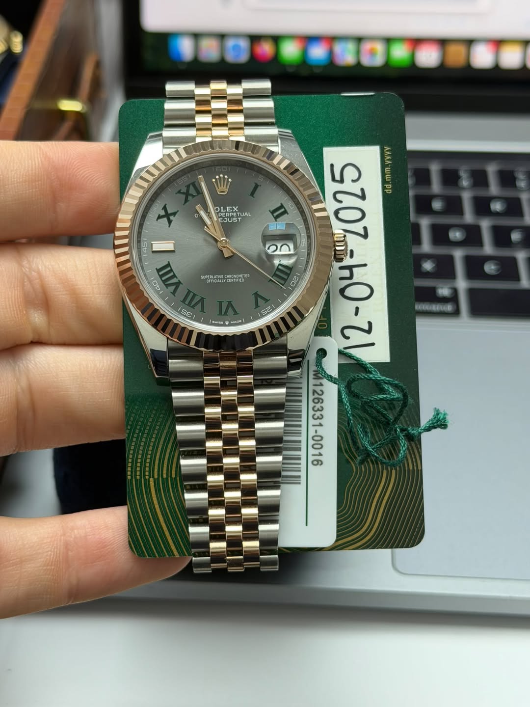 May be an image of wrist watch and text