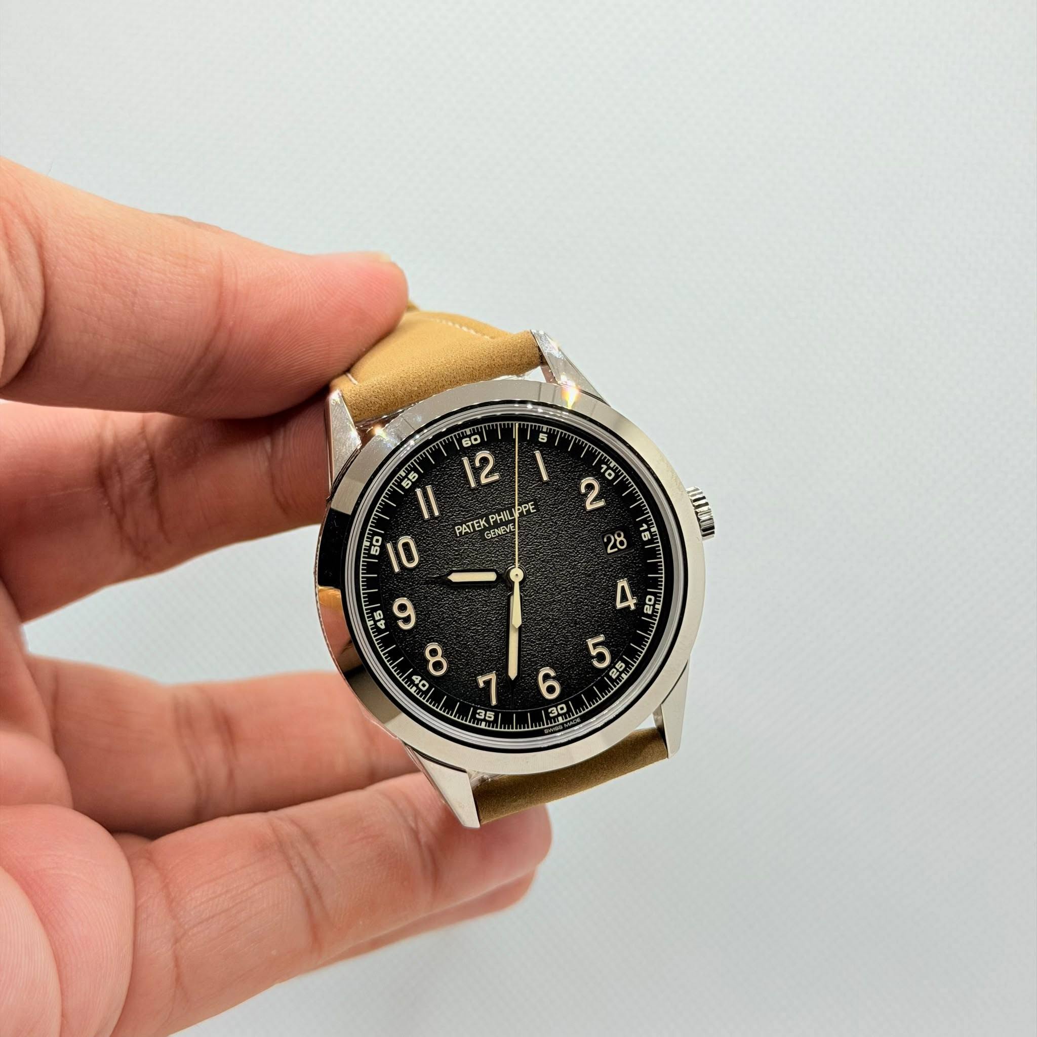 May be an image of wrist watch and text