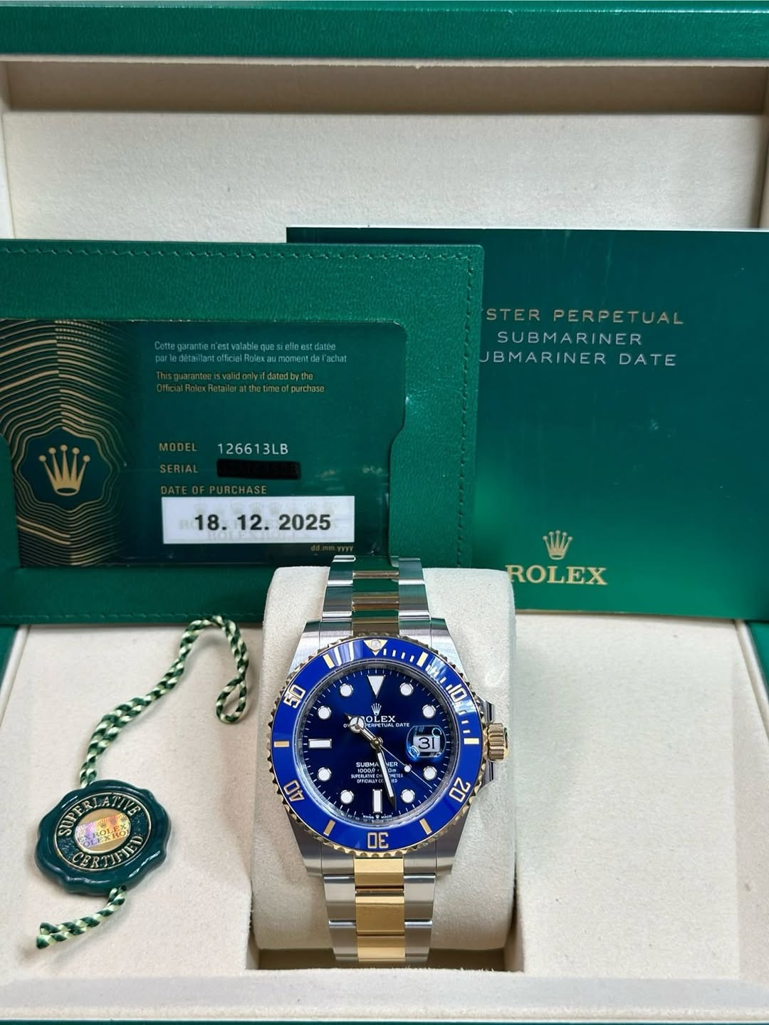 May be an image of wrist watch and text that says 'httprgereaeee atthemeatpurchase otpurchase STER PERPETUAL SUBMARINER JBMARINER DATE 126613LB W ROLEX 50 冰 POLE 10L ชล L ااس 10…