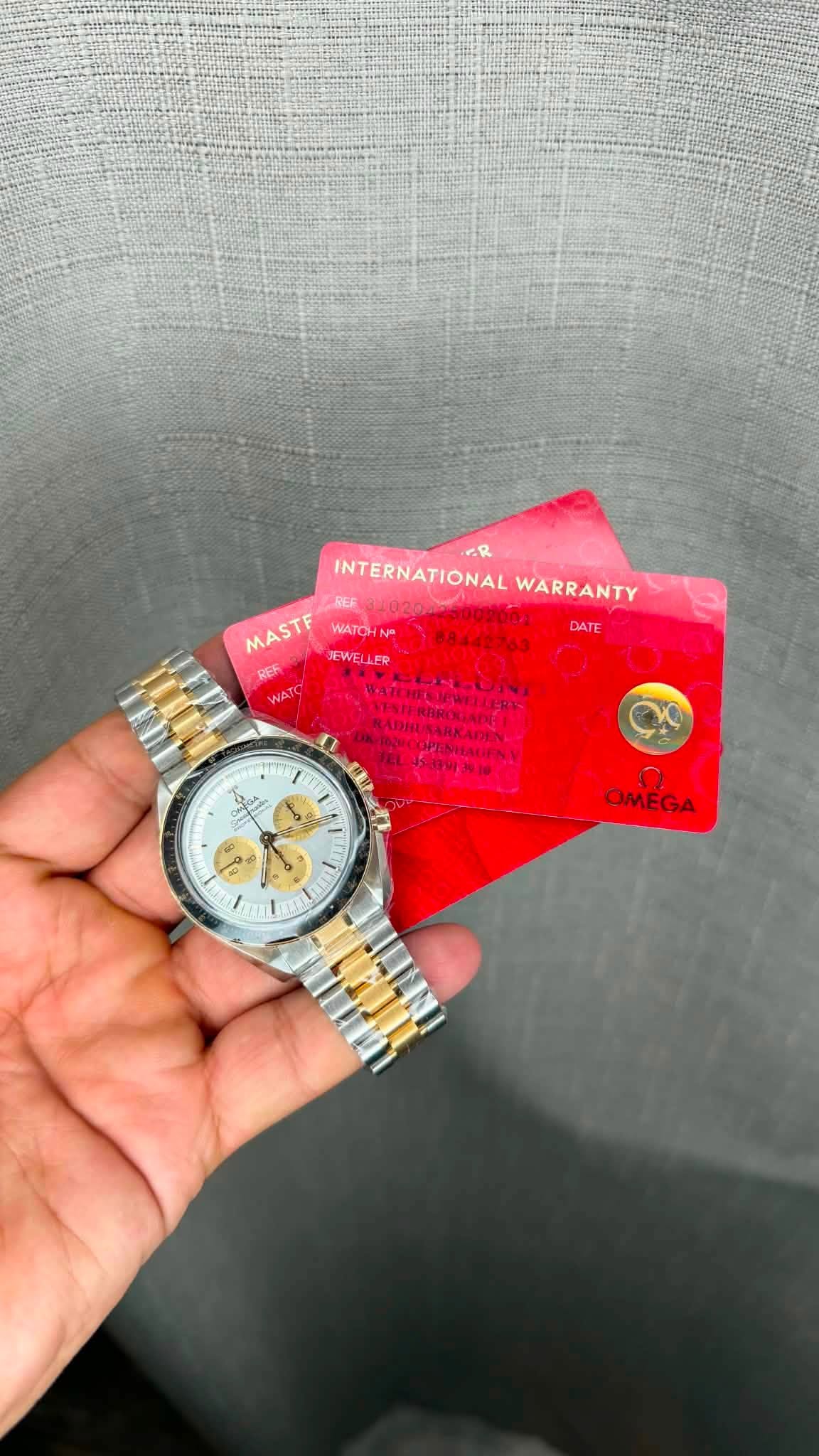 May be an image of money, wrist watch and text