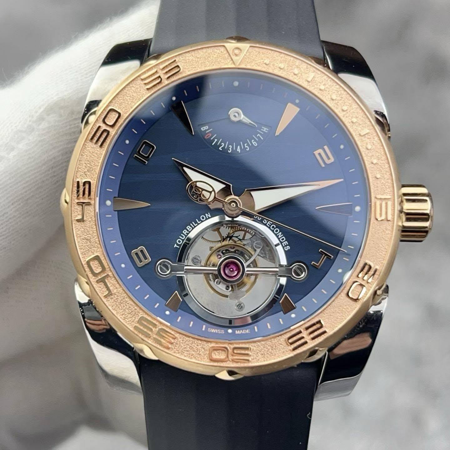 May be an image of wrist watch and text