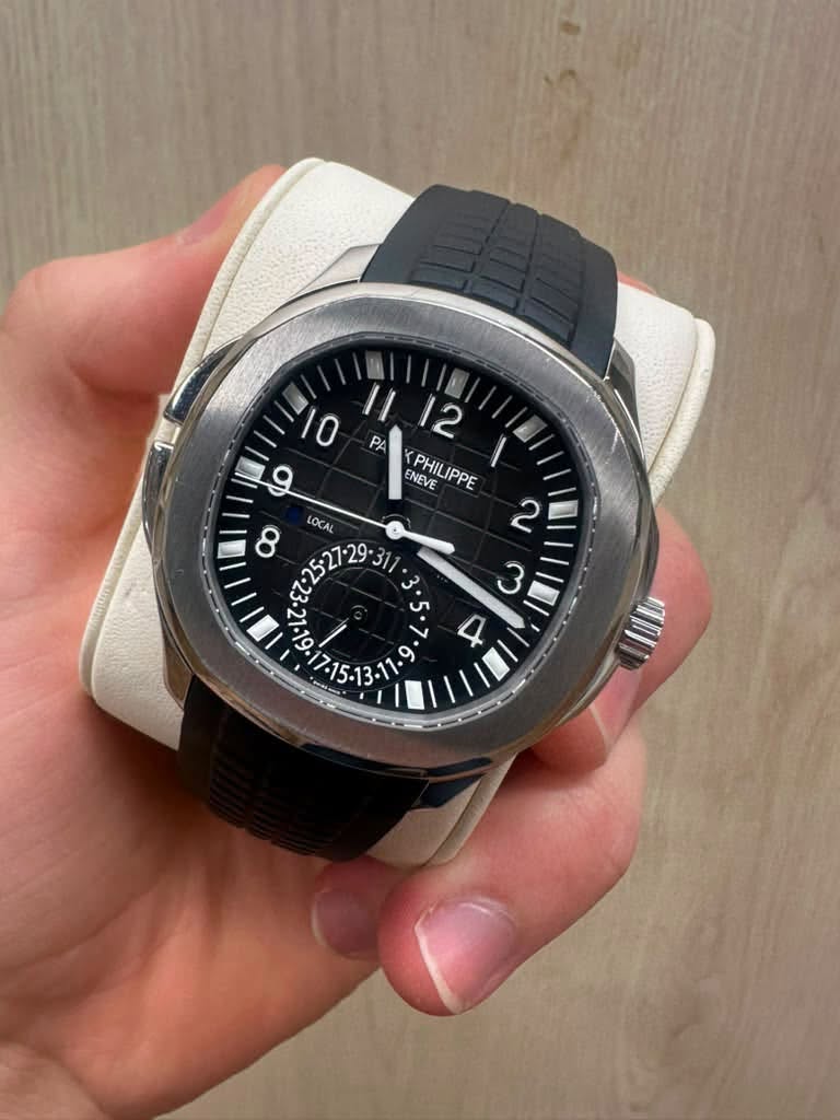 May be an image of wrist watch and text