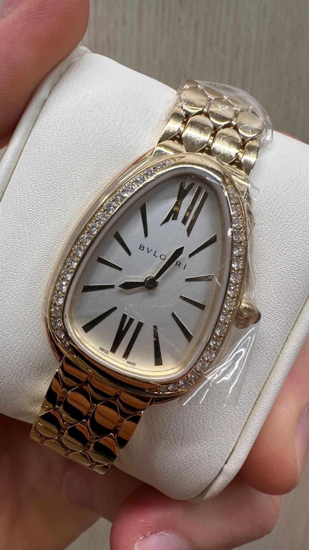 May be an image of wrist watch and text