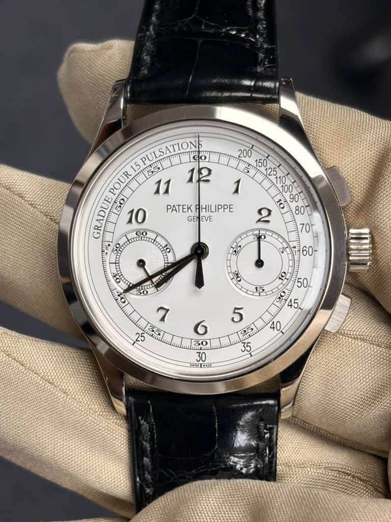 May be an image of wrist watch and text that says 'GES PULSATIONS 200 15 5Go yumm LII POUR GRADUE m50 10 90 PATEK PATEKPHILIPPE HILIPPE 80 GENEVE GEN EVE TRR 60- 5 O Amr 35 6 30 E…