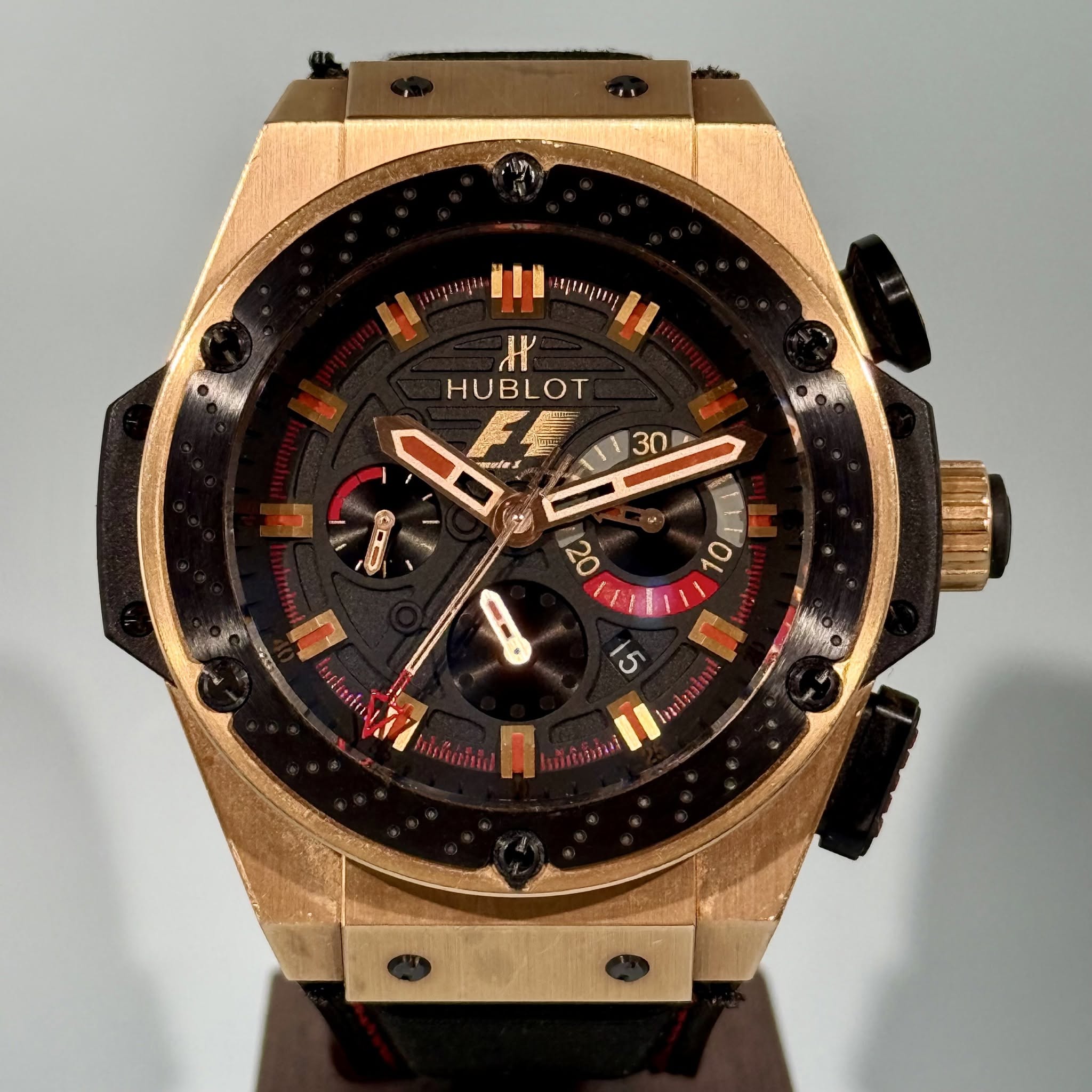 May be an image of wrist watch and text
