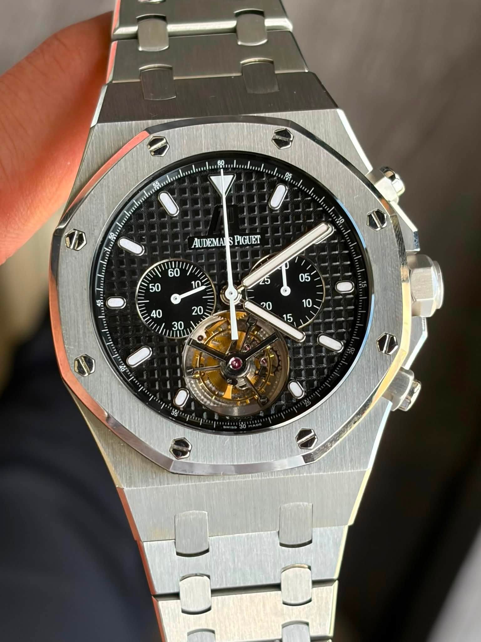 May be an image of wrist watch and text