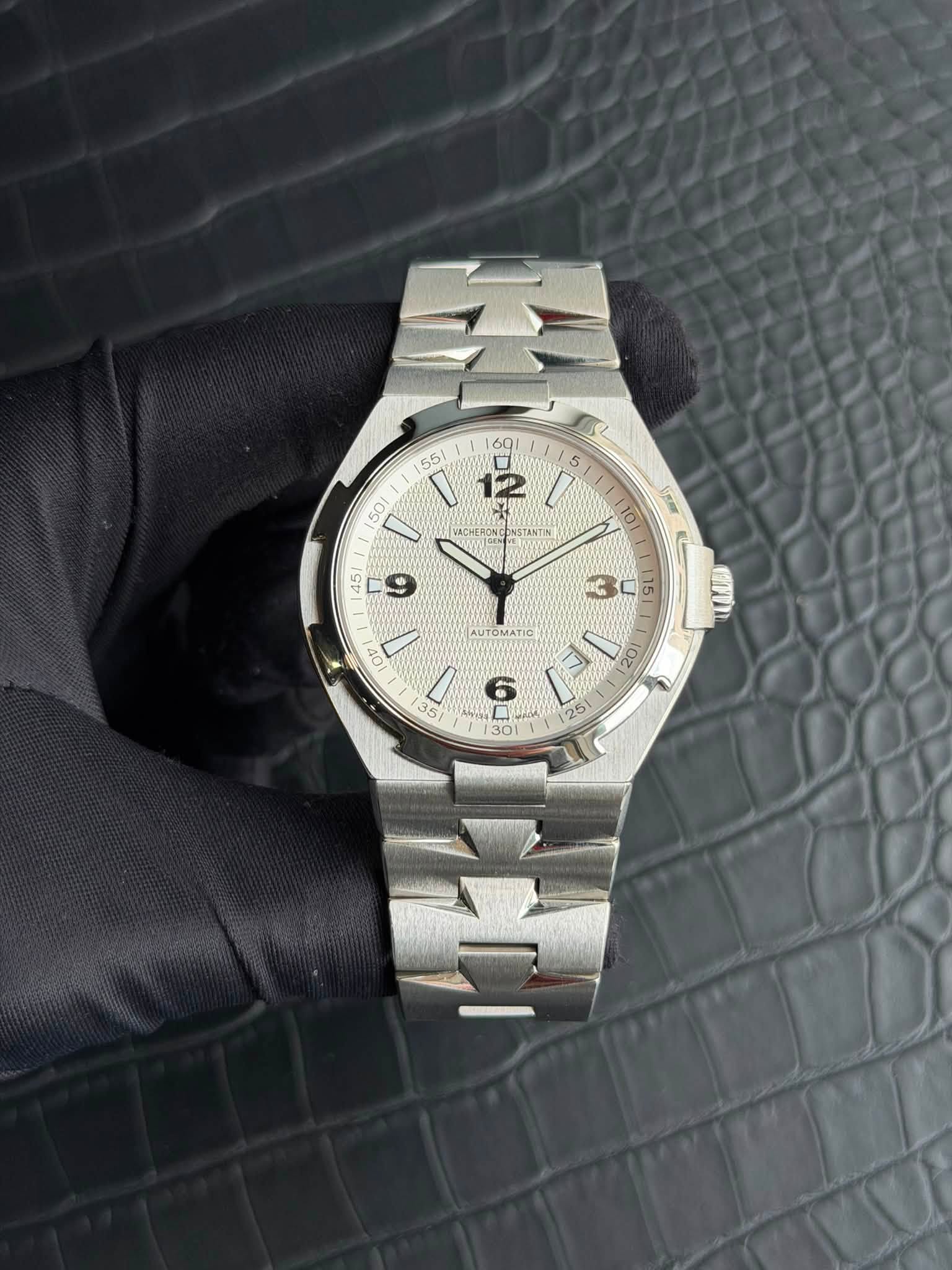May be an image of wrist watch and text