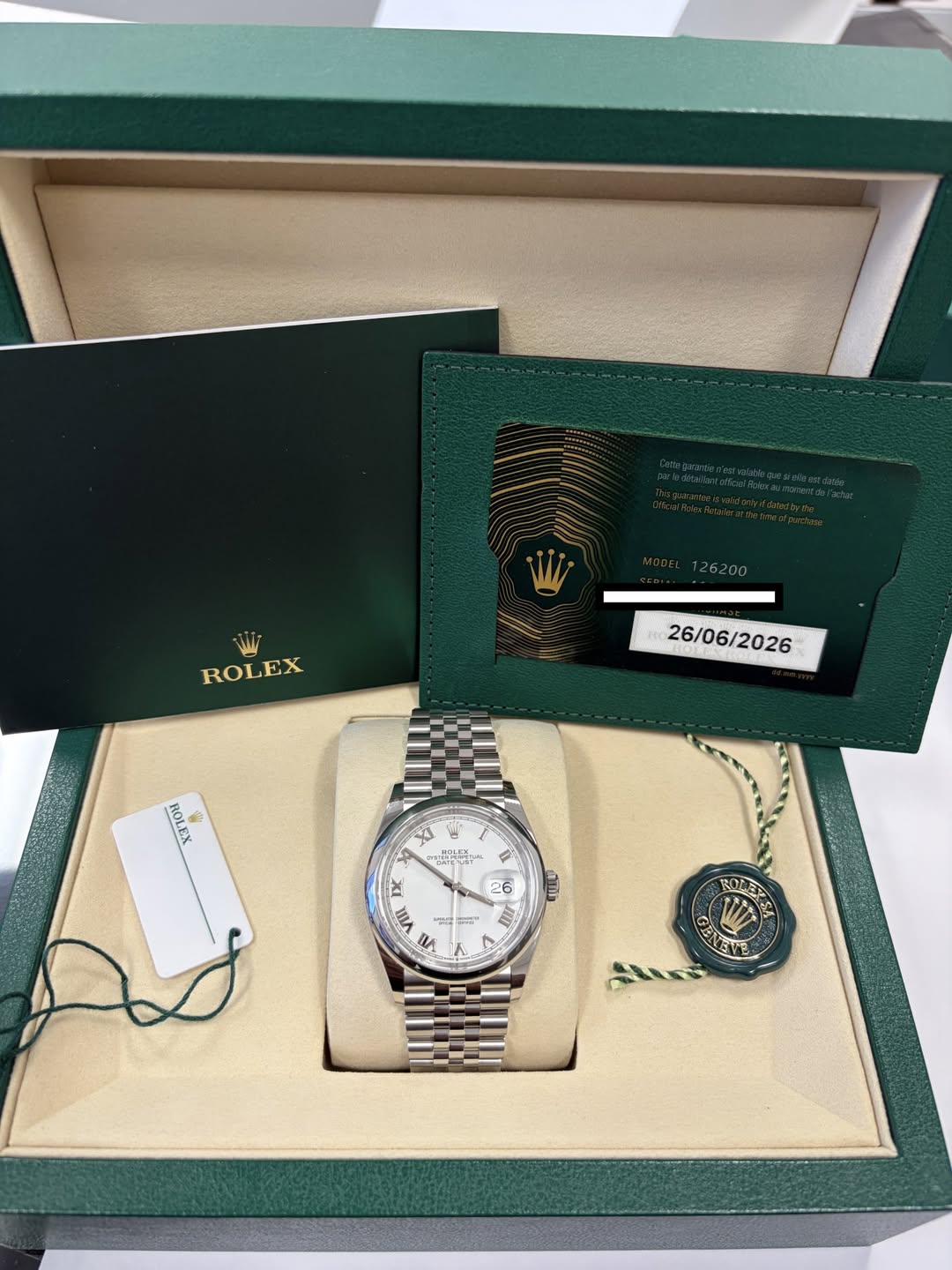 May be an image of wrist watch and text