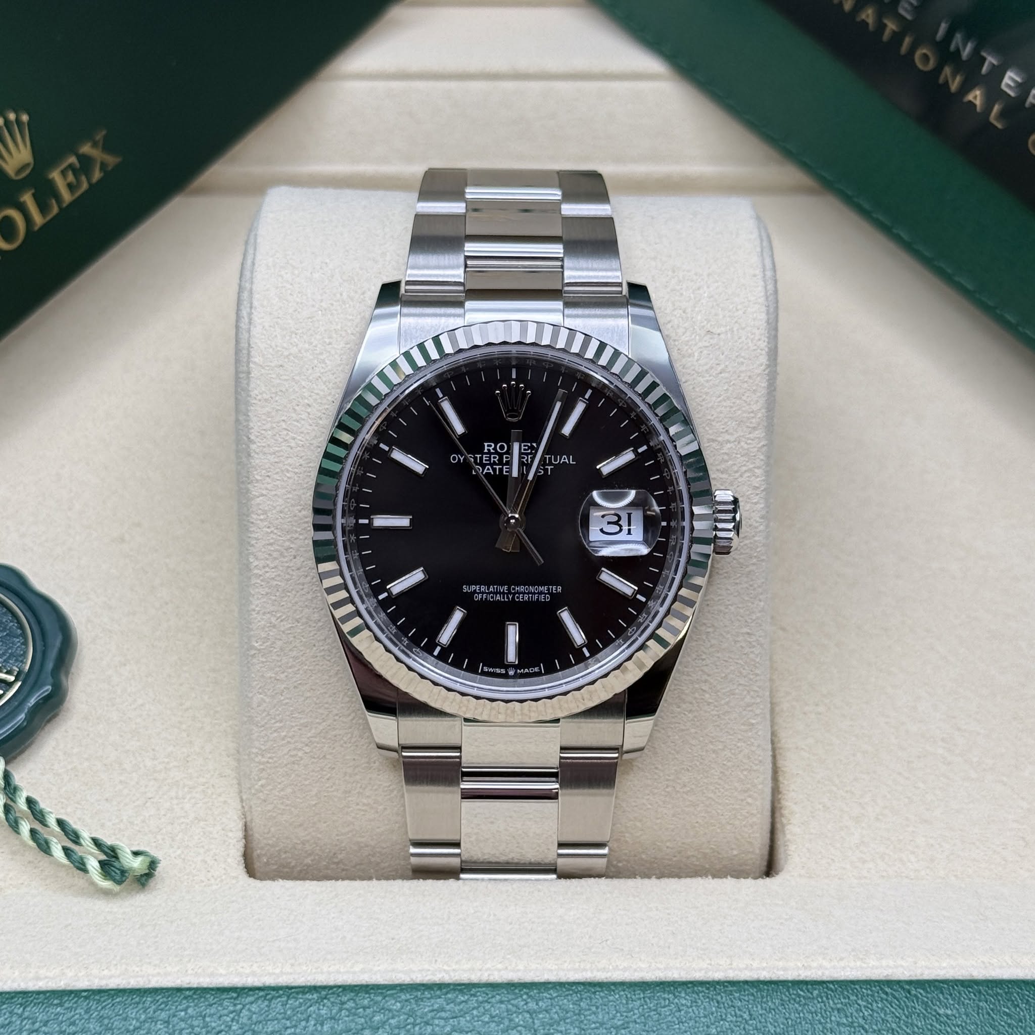 May be an image of wrist watch and text