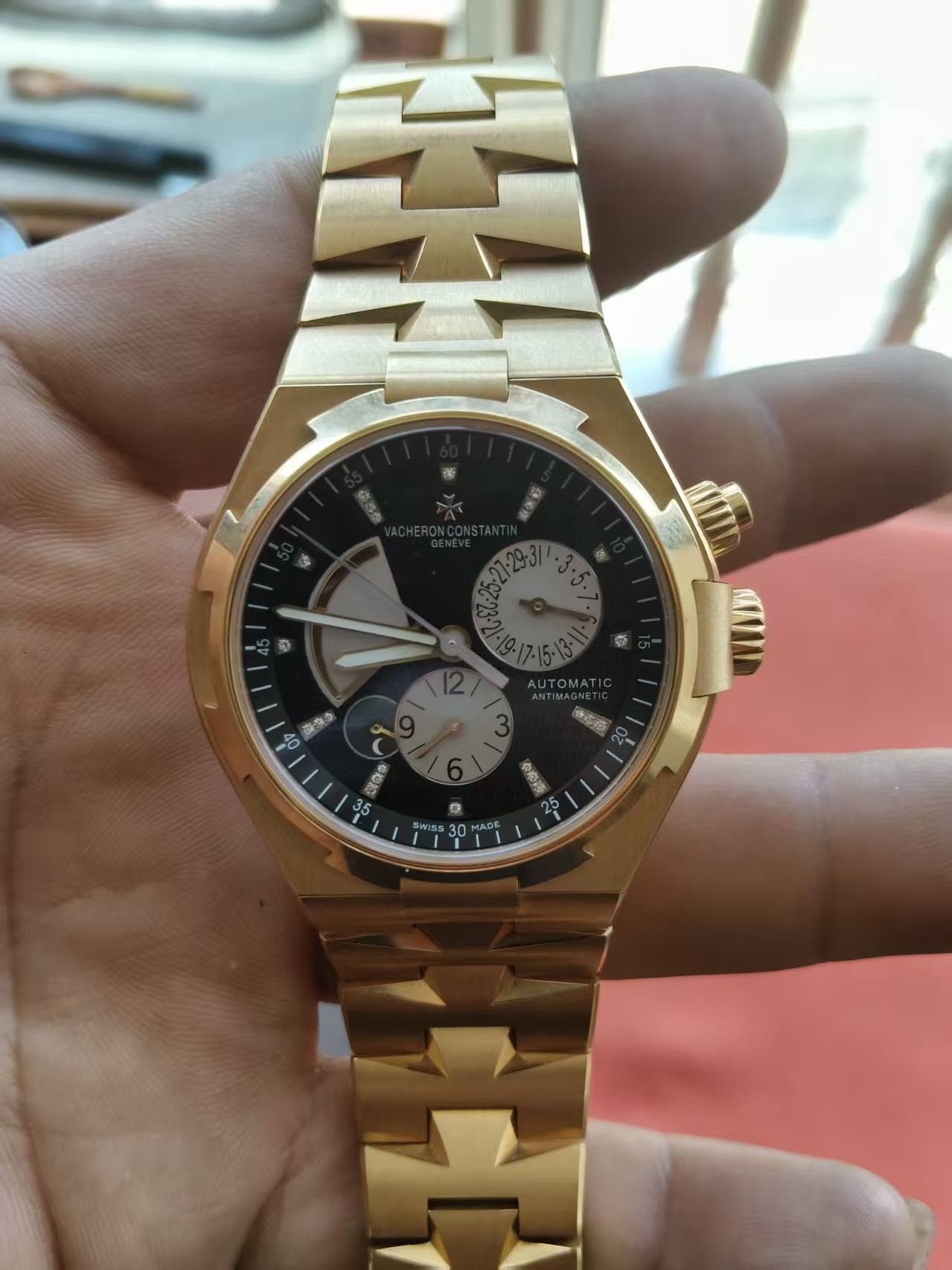 May be an image of wrist watch and text