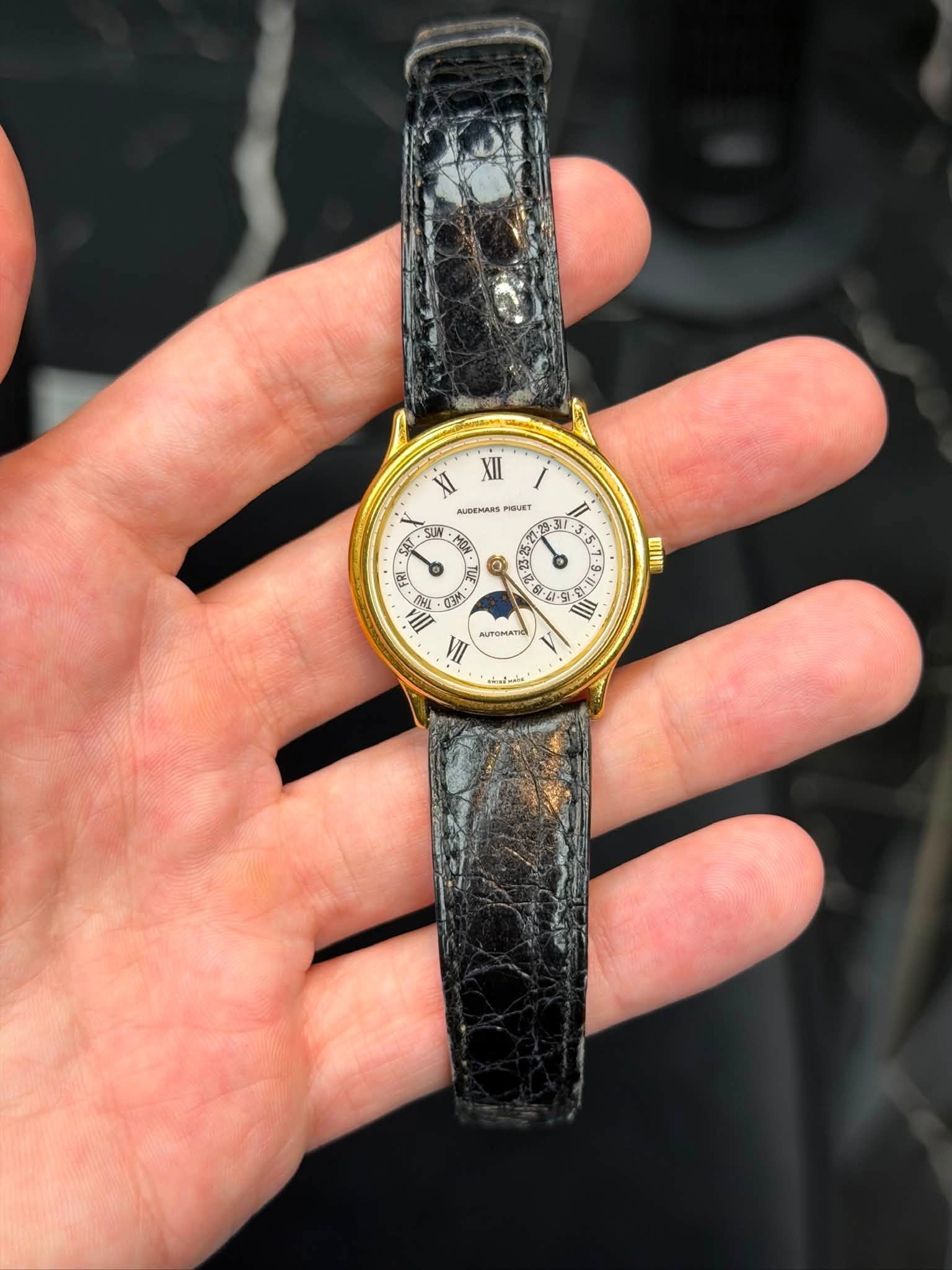 May be an image of wrist watch and text