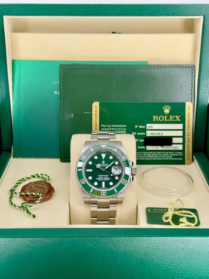 May be an image of wrist watch and text that says 'SL Pour informations compler omplementaires entaires GARANTE client 265 ROLEX RMt. montre 116610LV รยต 0 50 Modile OYSTER…