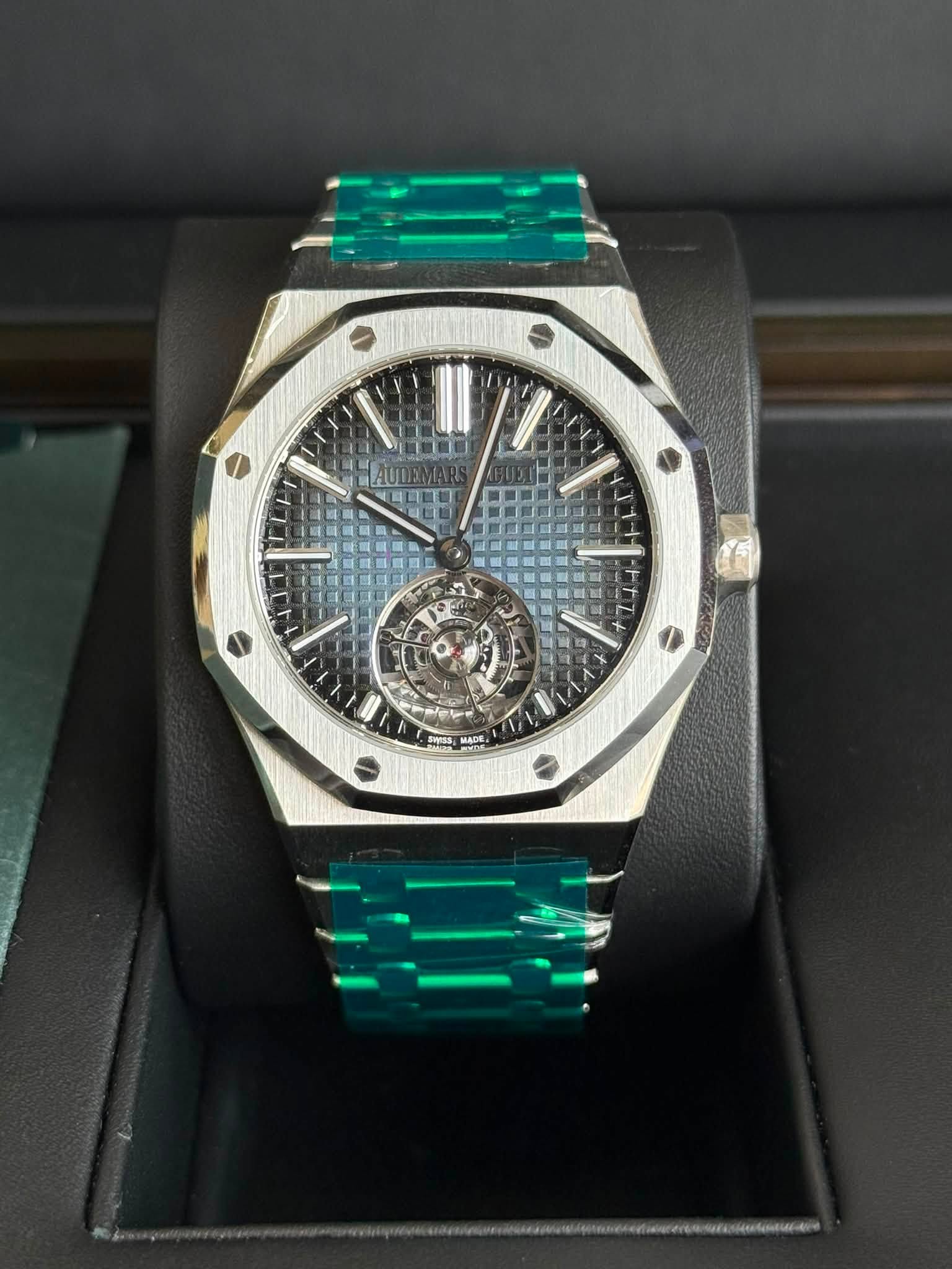 May be an image of wrist watch and text