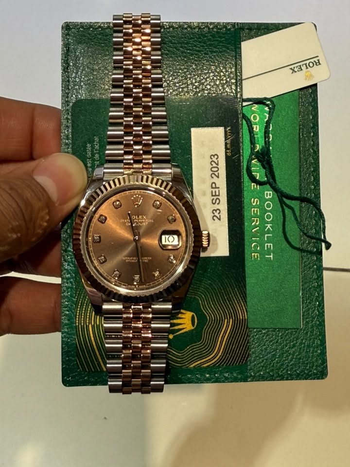 May be an image of wrist watch and text
