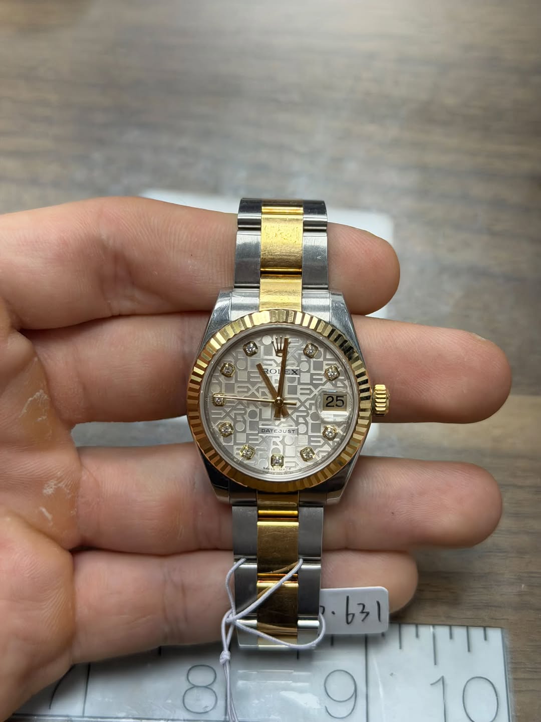 May be an image of wrist watch and text