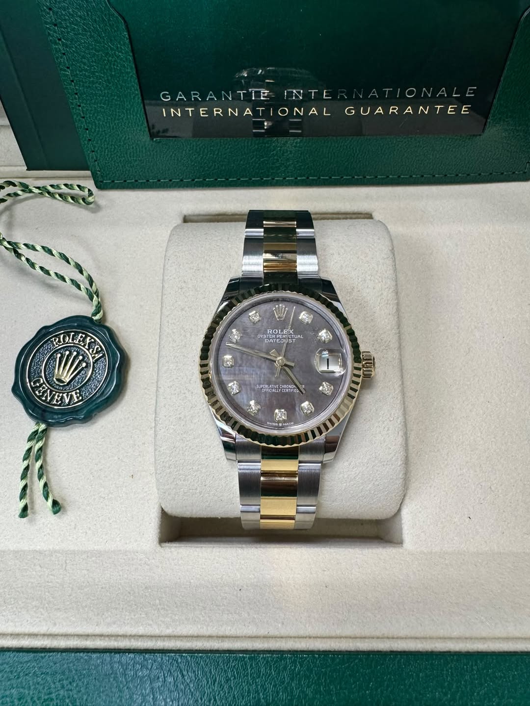 May be an image of wrist watch and text