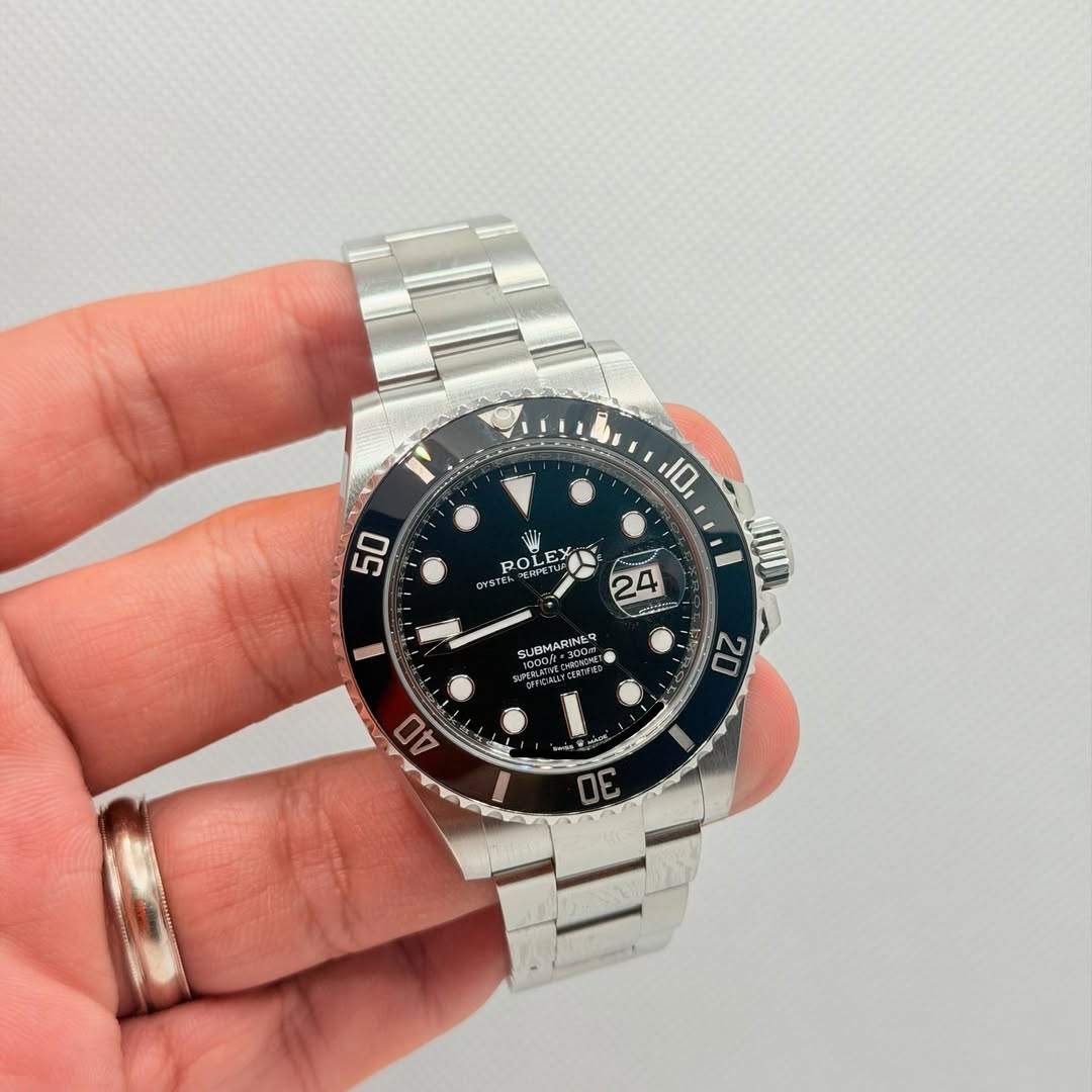 May be an image of wrist watch and text