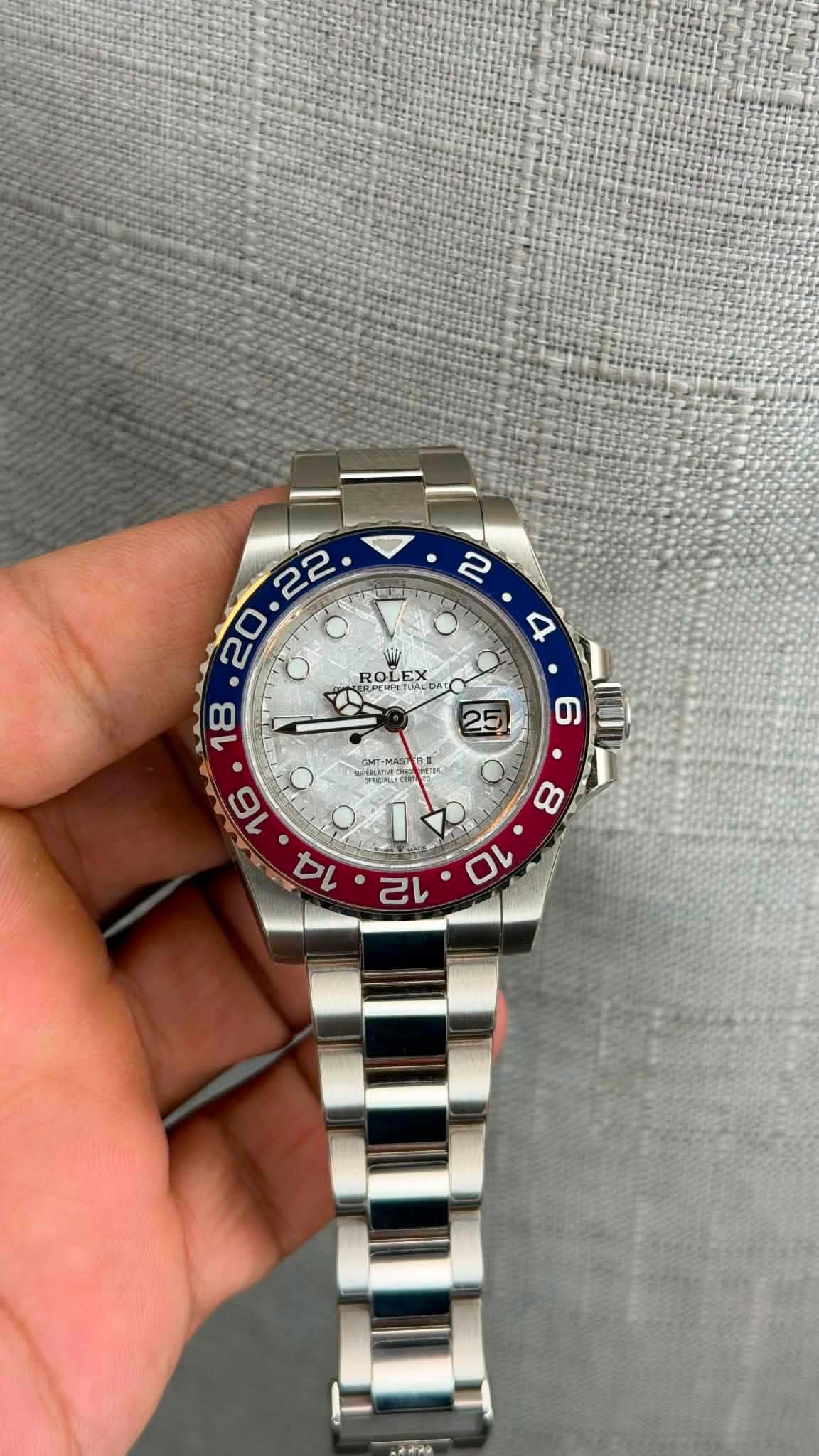 May be an image of wrist watch and text