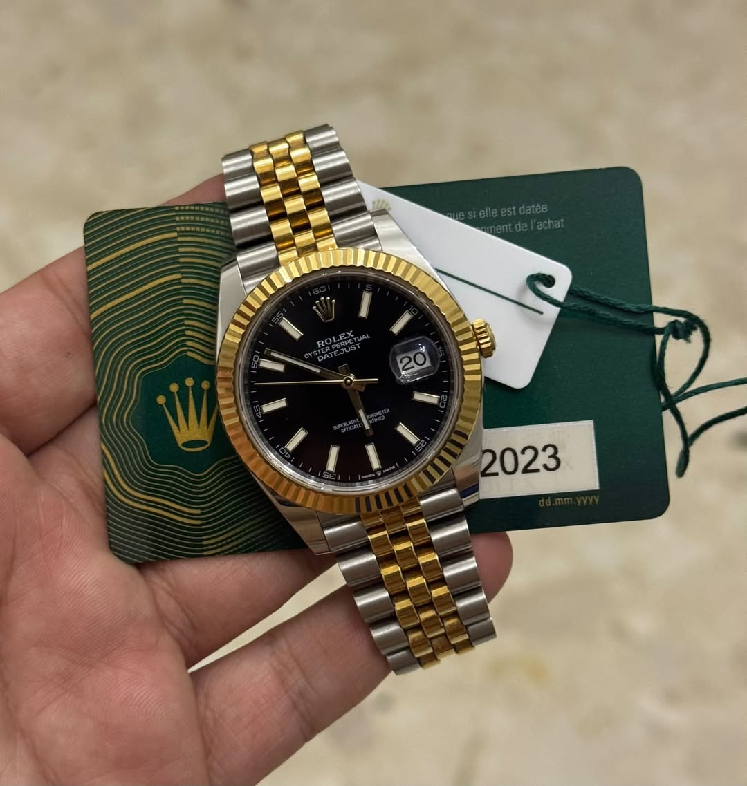 May be an image of wrist watch and text