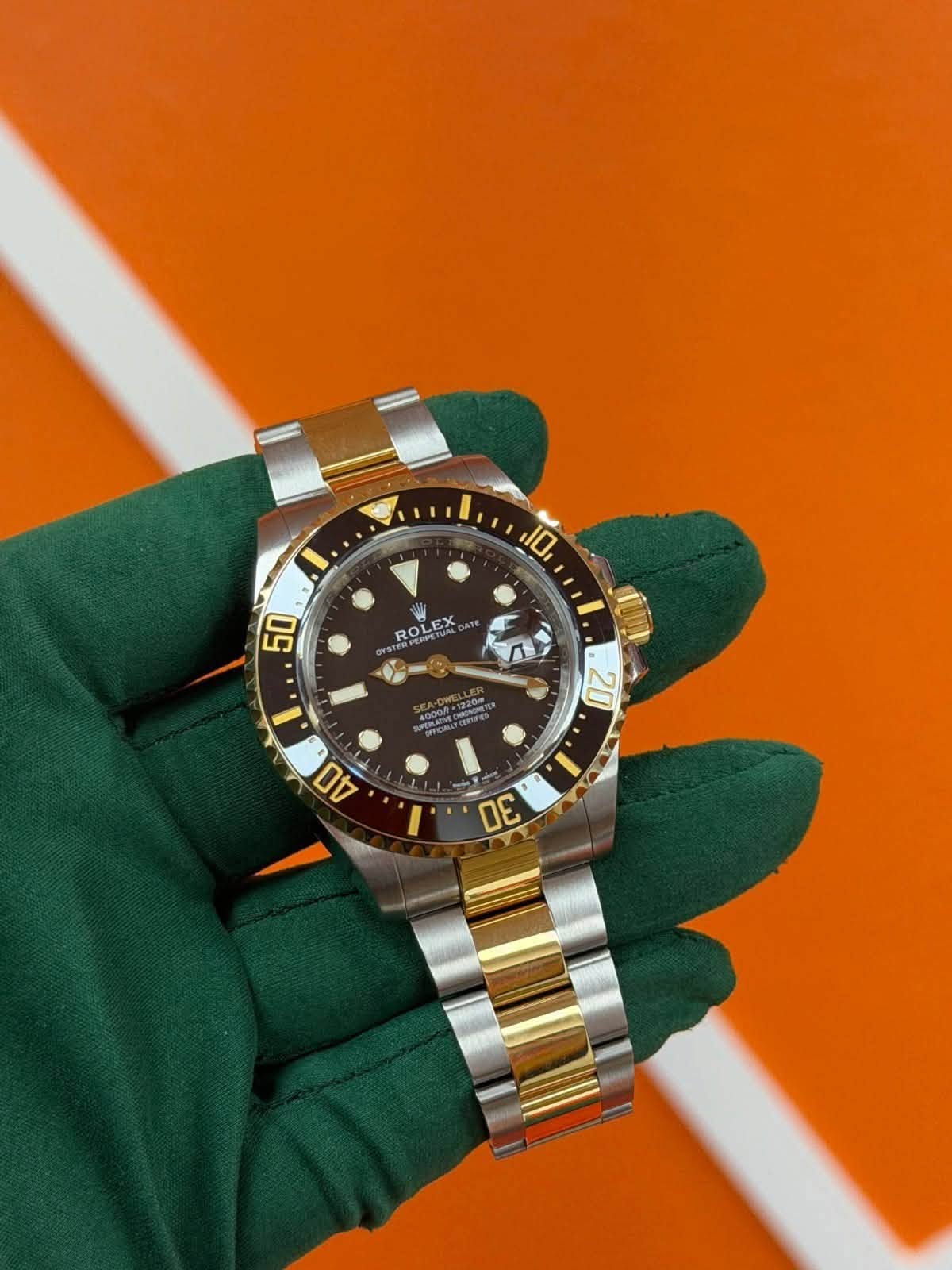 May be an image of wrist watch and text