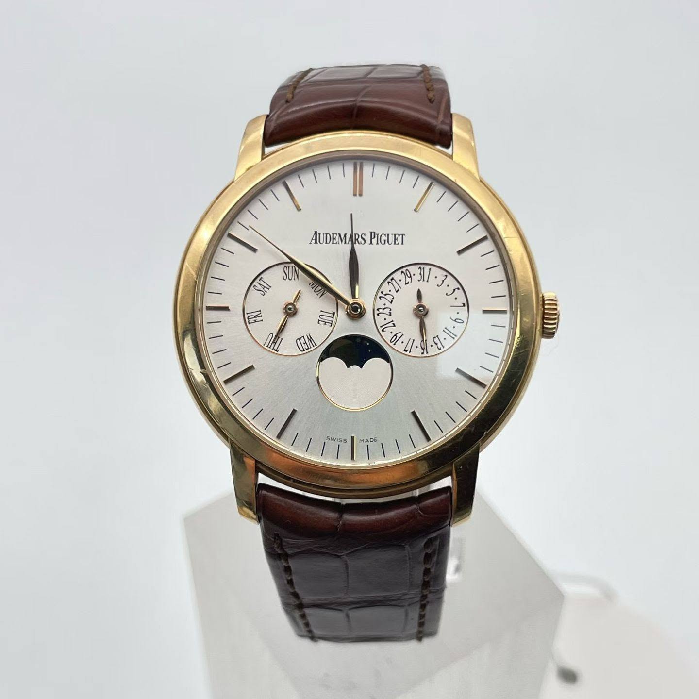 May be an image of wrist watch and text