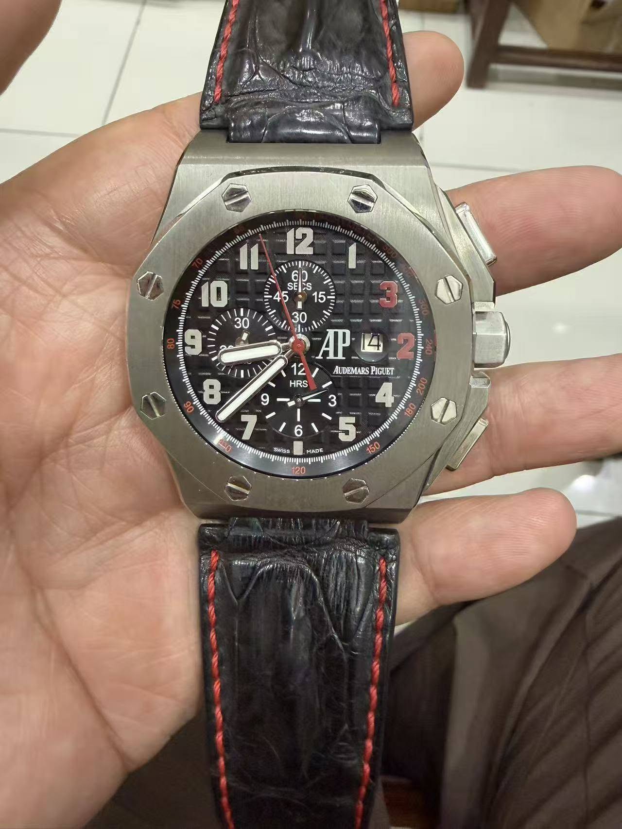 May be an image of wrist watch and text