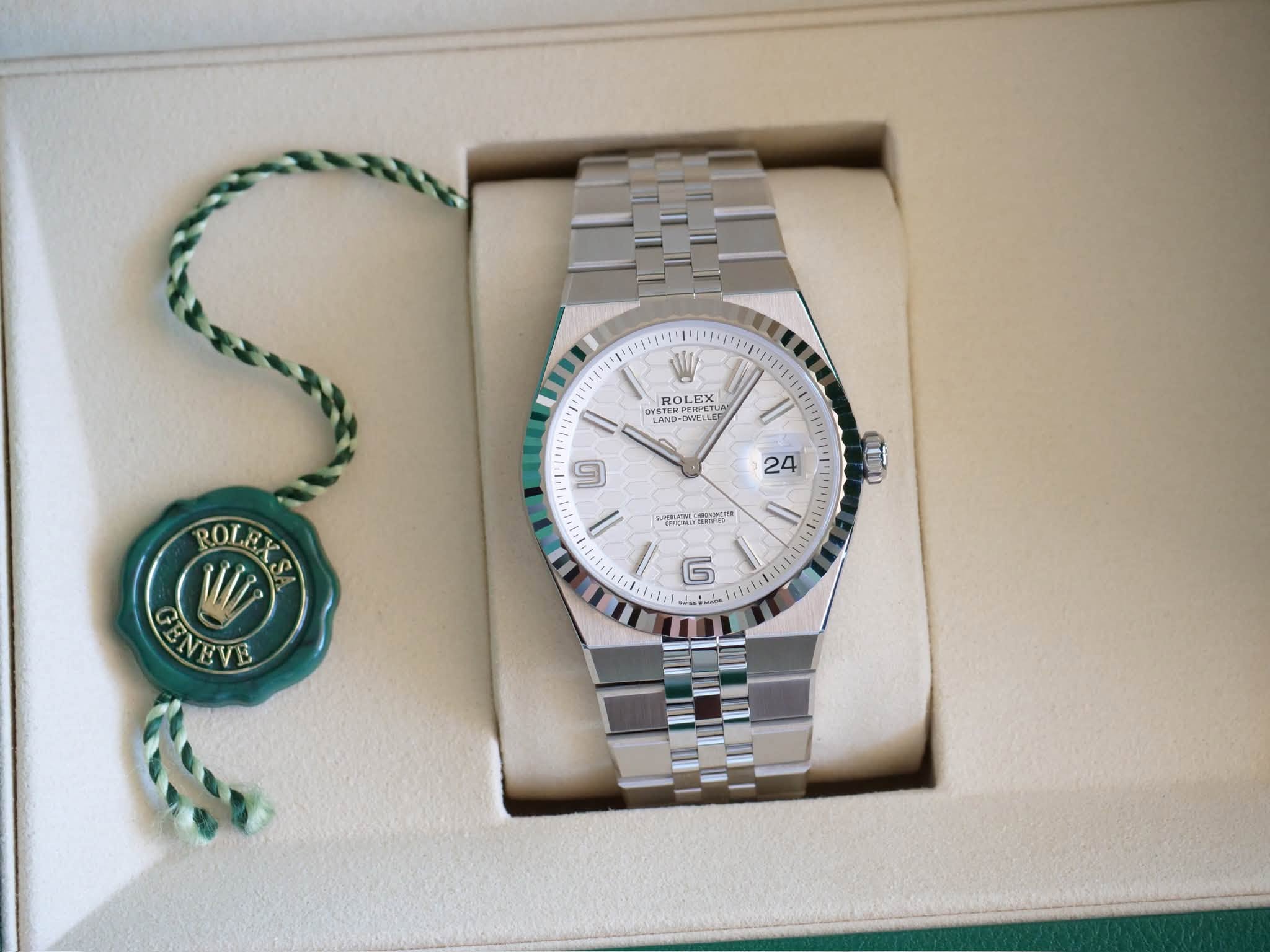 May be an image of wrist watch and text