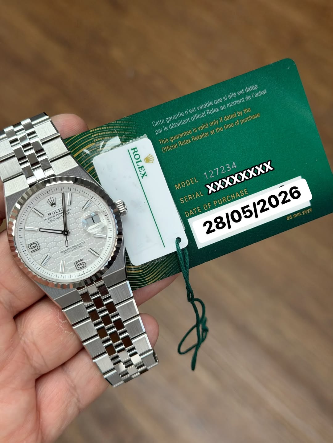 May be an image of wrist watch and text that says 'st datée achat valable que ellee est noment del Cette garantie n'est Officiel Rolex datedby the detailiant valid only par…