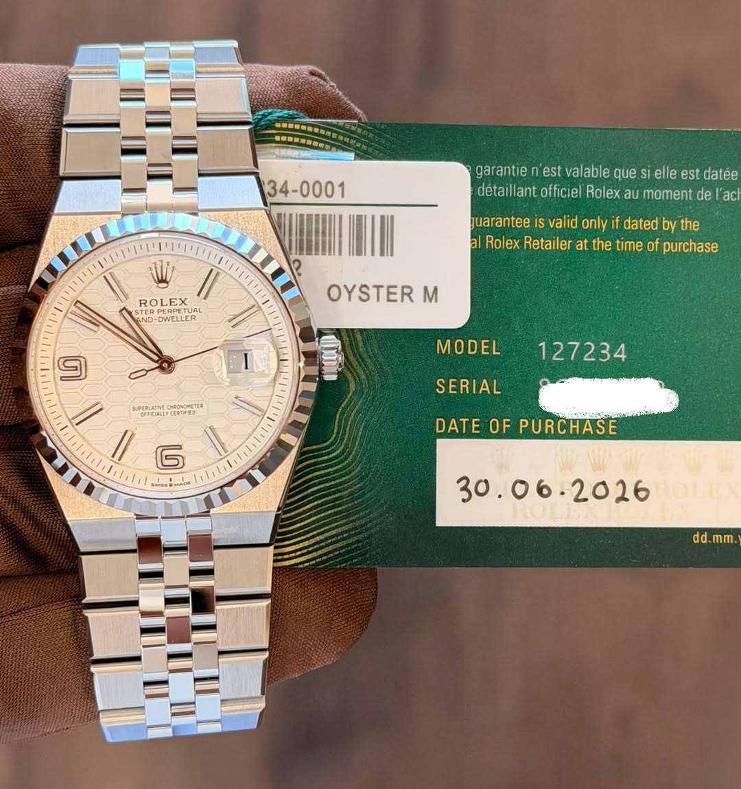 May be an image of wrist watch and text that says '34-0001 garantie 'est valable que elle est datée détaillantofficiel officiel Rolex au moment de act guarantee valid only if…