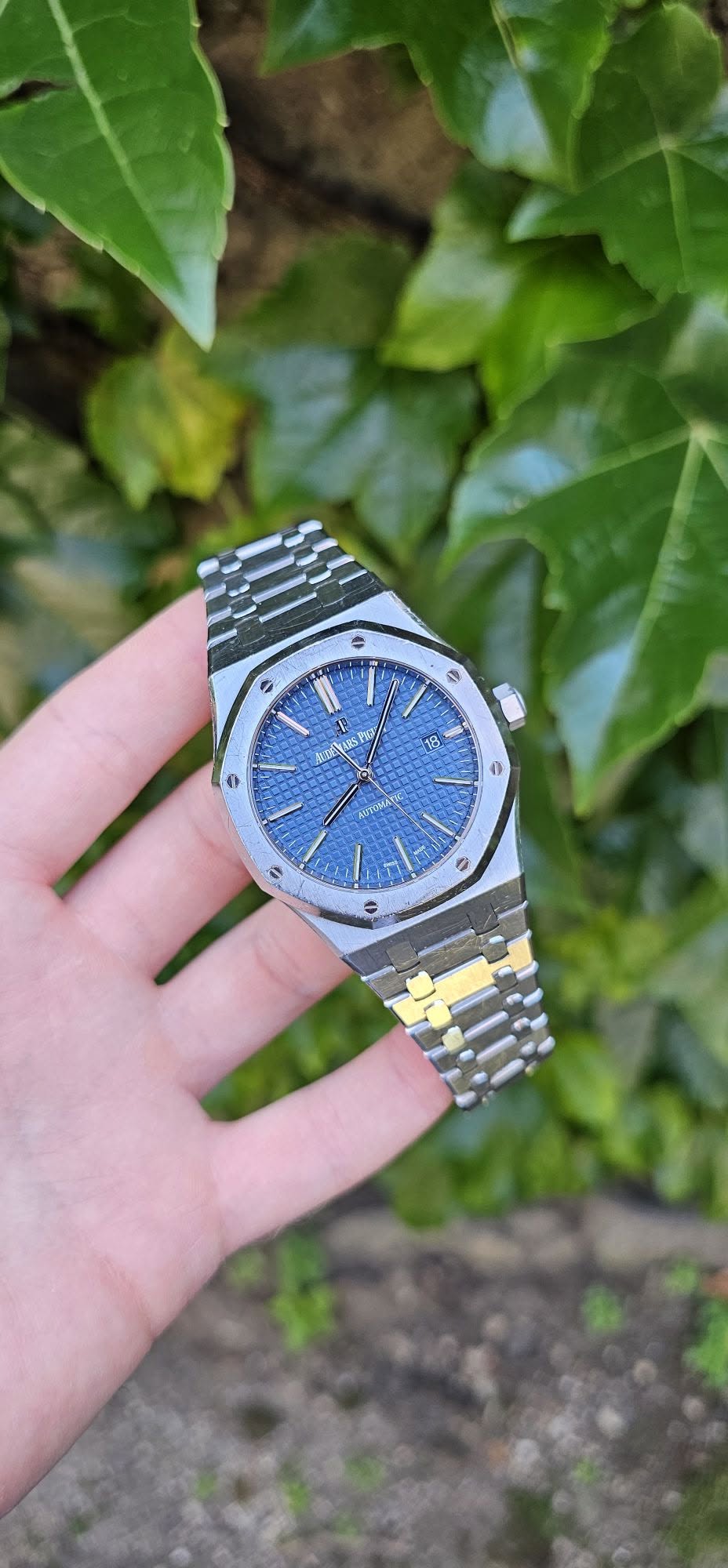 May be an image of wrist watch and text